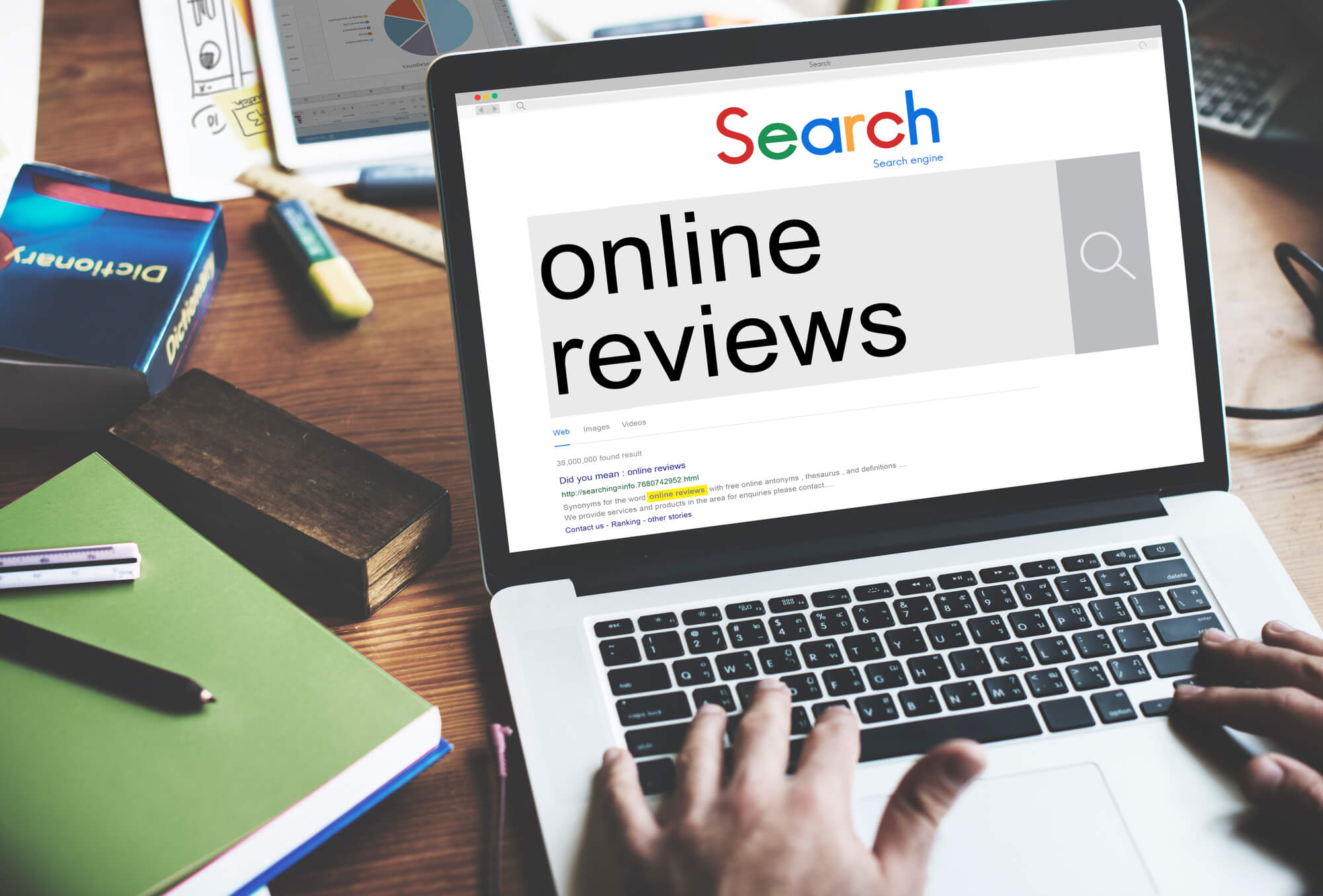 man typing online reviews in search engine