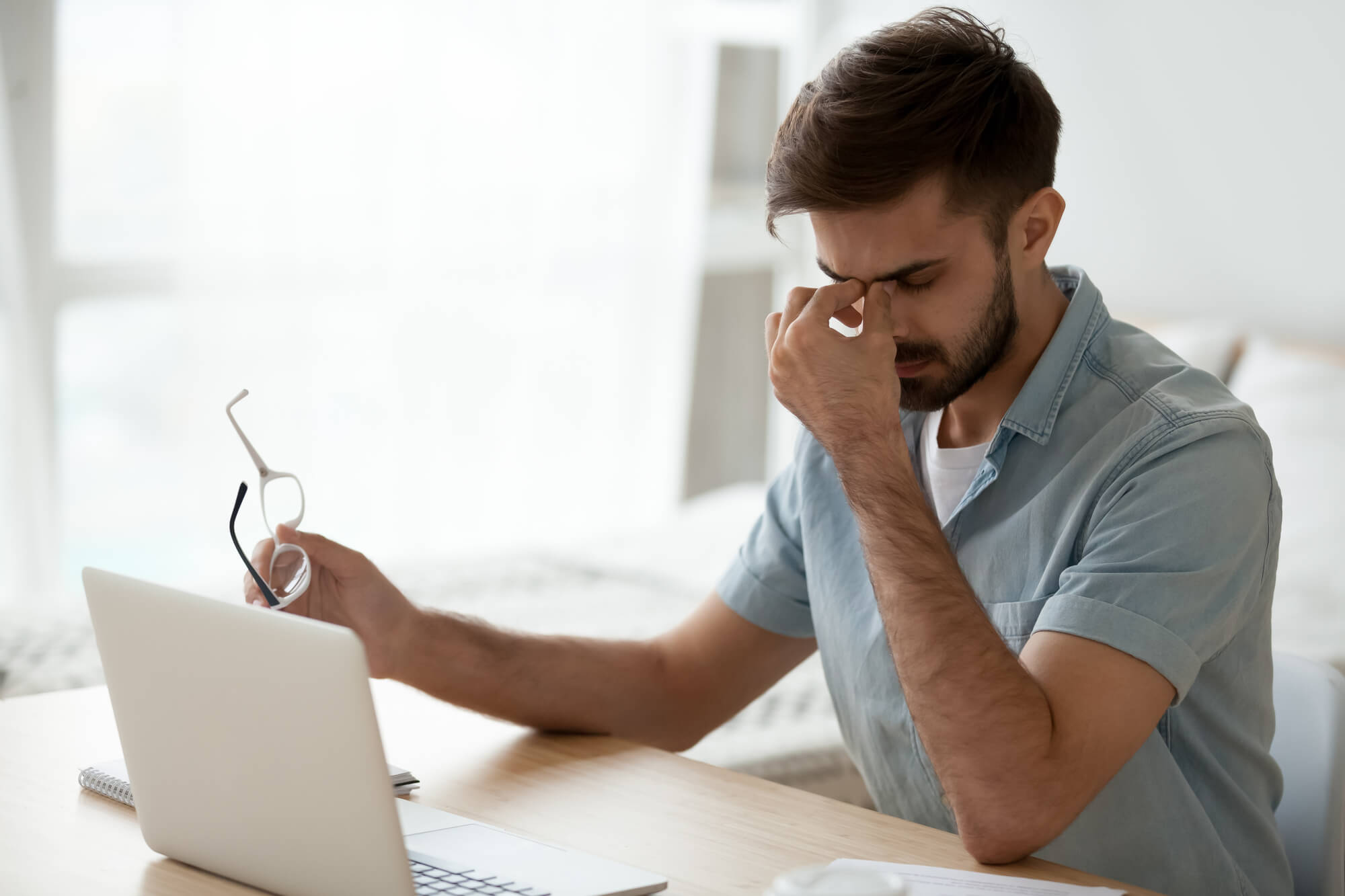 business man burnt out from multitasking