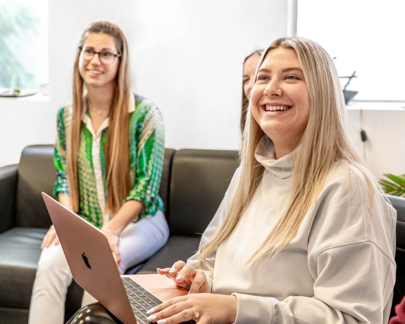 female digital advertising manager leads meeting at local marketing agency