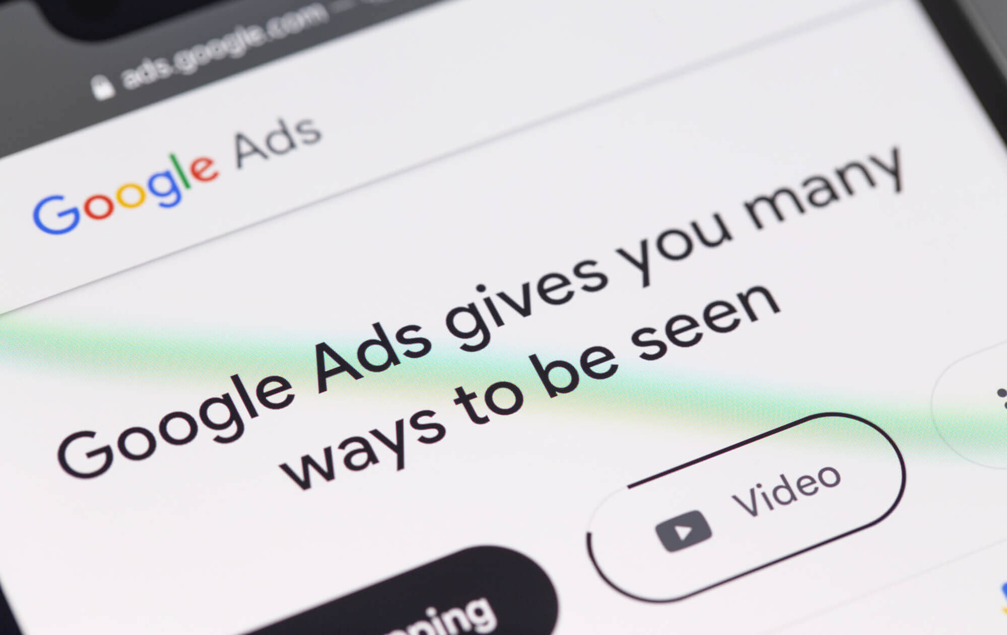 smartphone screen displaying Google Ads and a message saying Google Ads gives you many ways to be seen