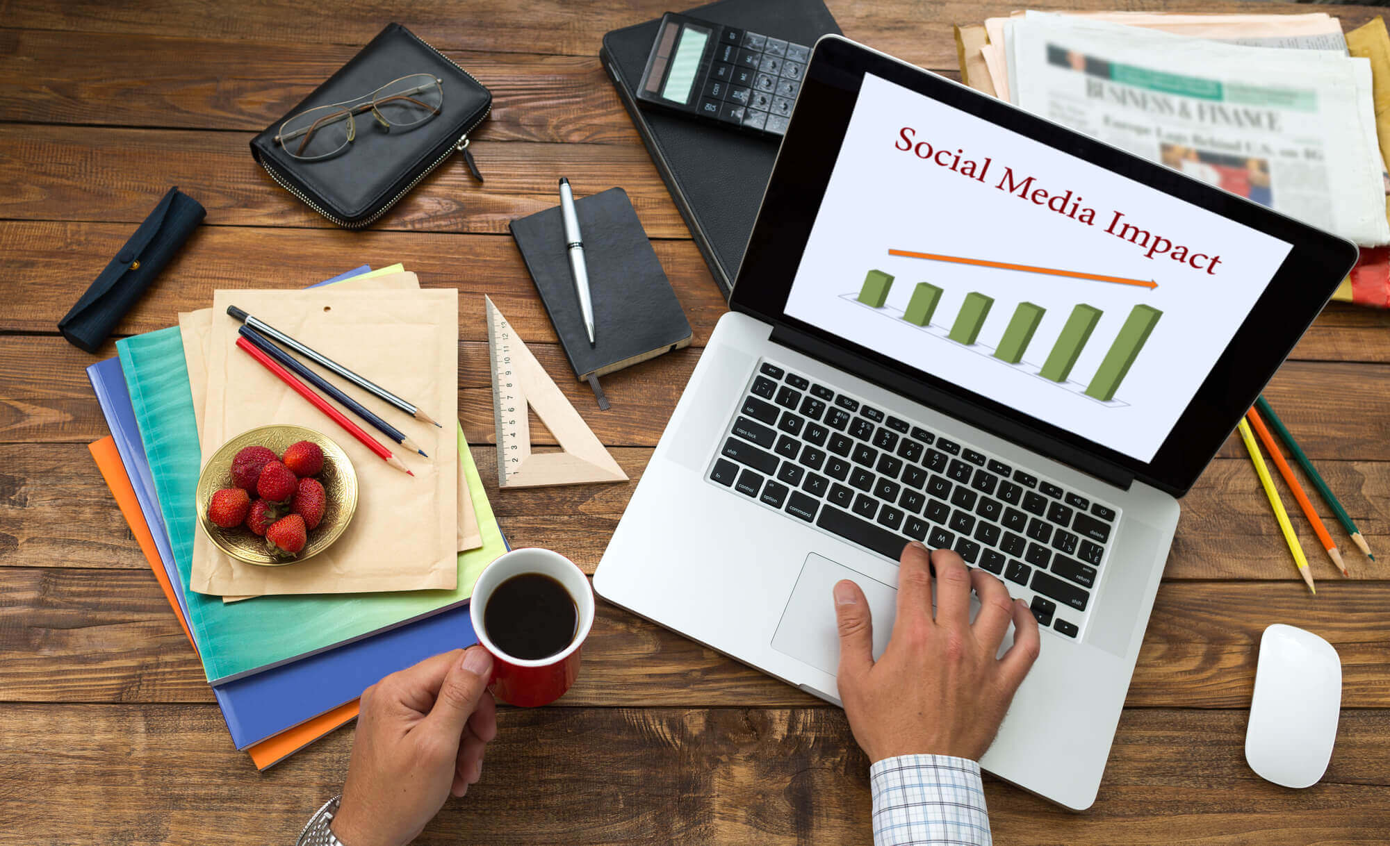 businessman analyzing social media impact on a laptop