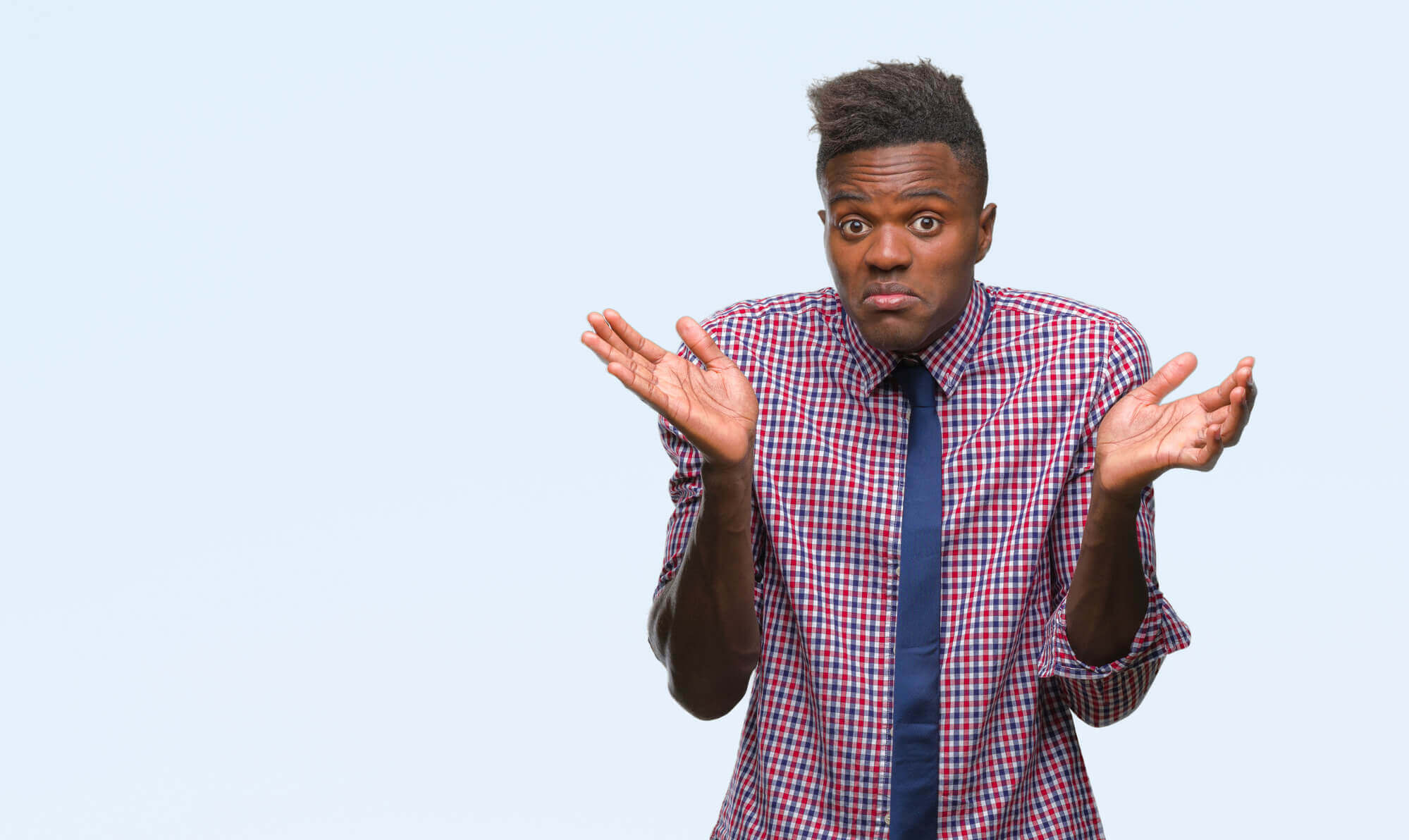 male professional shrugging to indicate curiosity