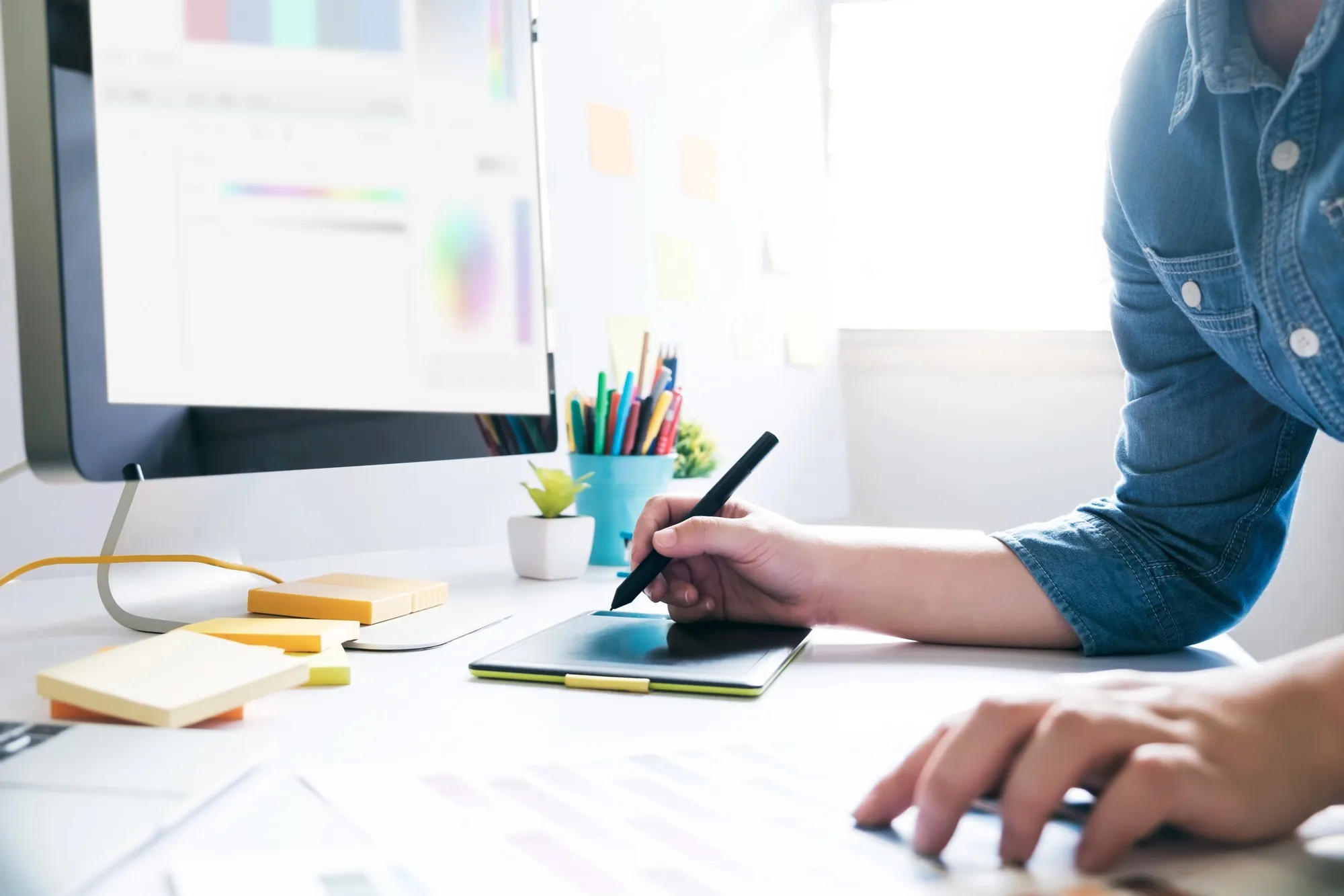 ai seo pricing digital marketing specialist using graphics tablet