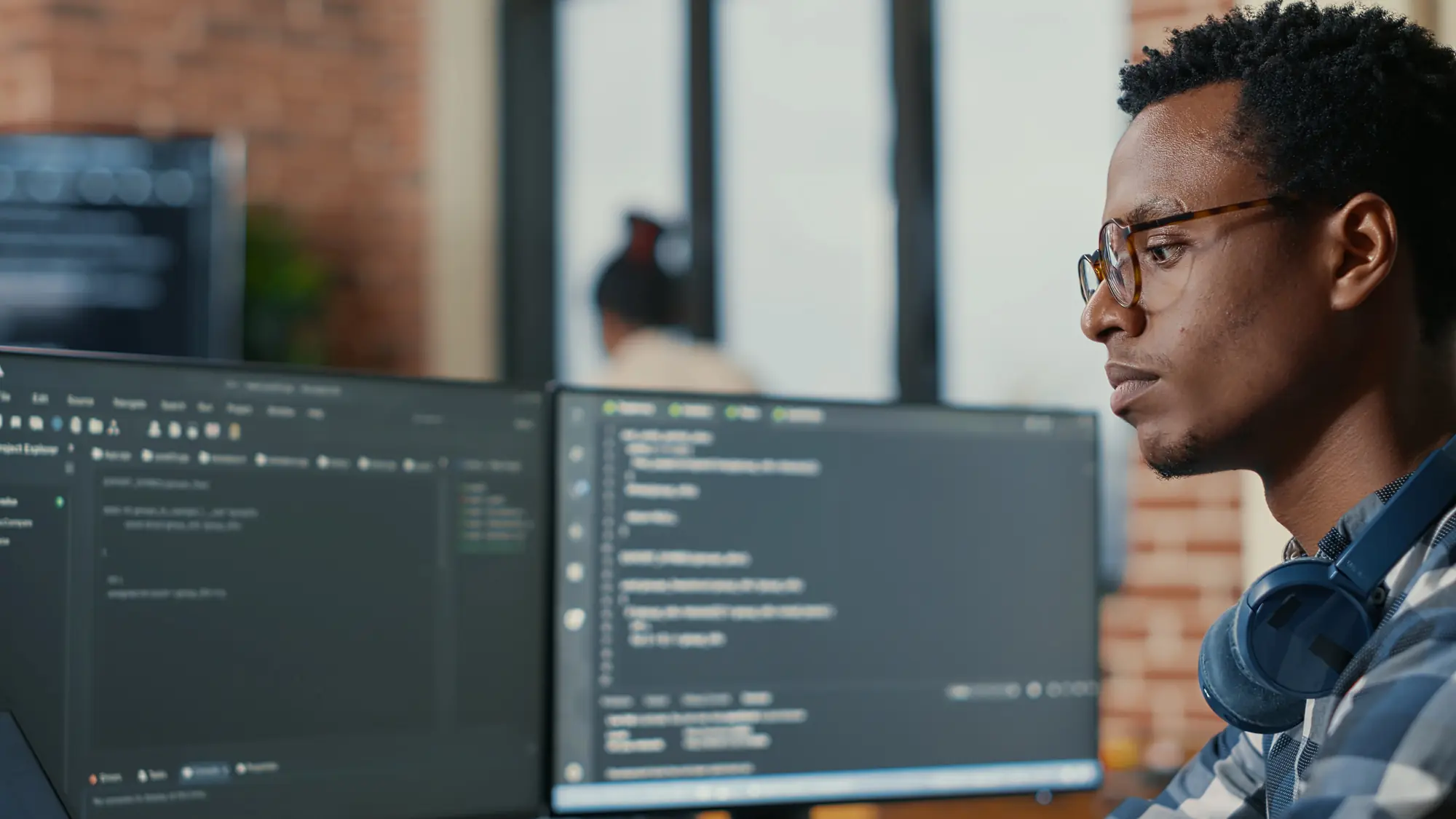 Web developer coding and optimizing a business website as part of South Florida AIO company web development services