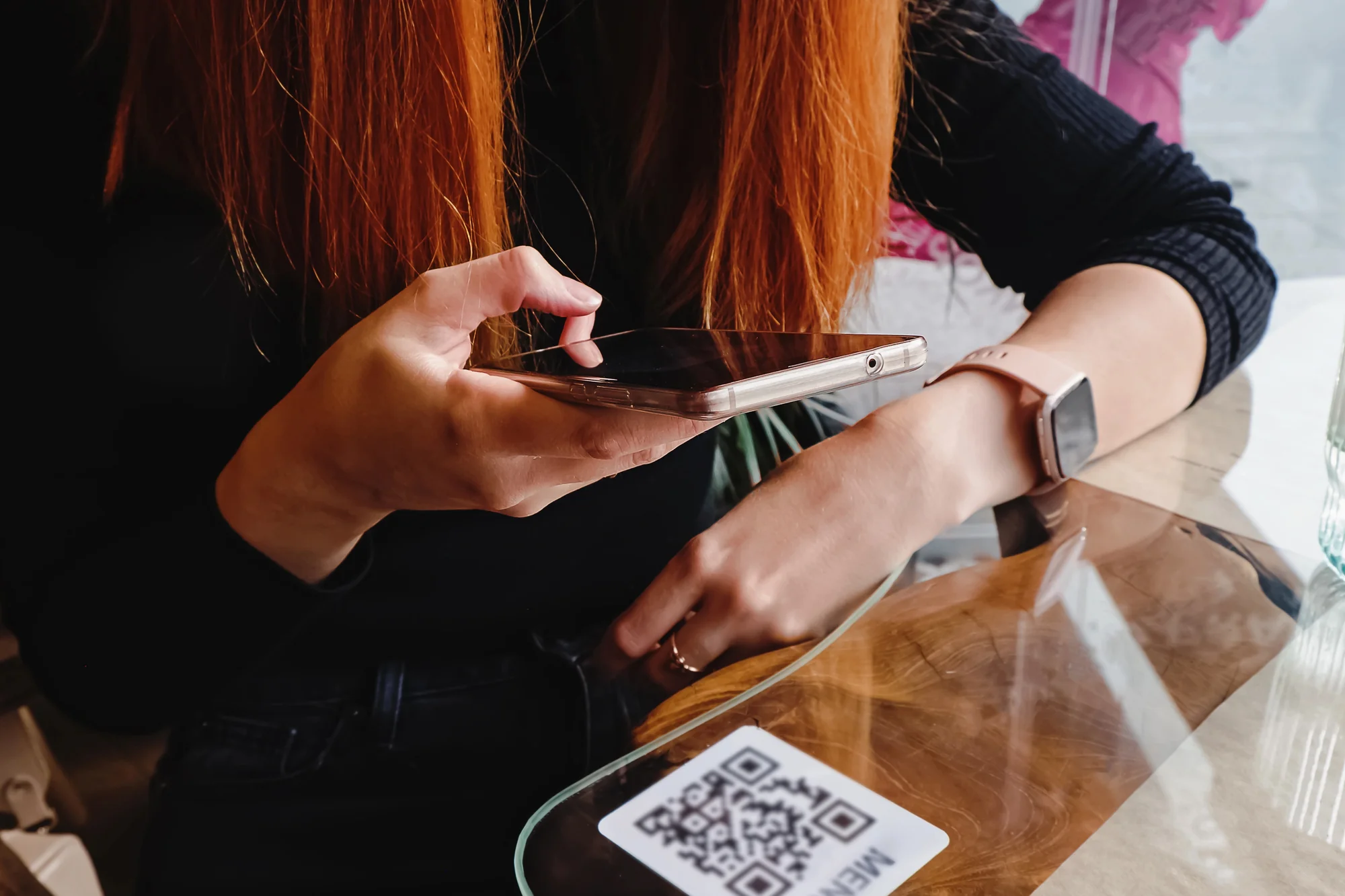 Customer scanning a QR code on a cafe table with a smartphone, a simple way review generation services collect Google reviews