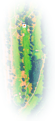 Aerial view of a golf course hole with fairways, sand bunkers, trees, and bordering road.