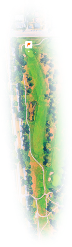Aerial view of a golf course hole with fairway, bunkers, green, and surrounding trees near a residential area.