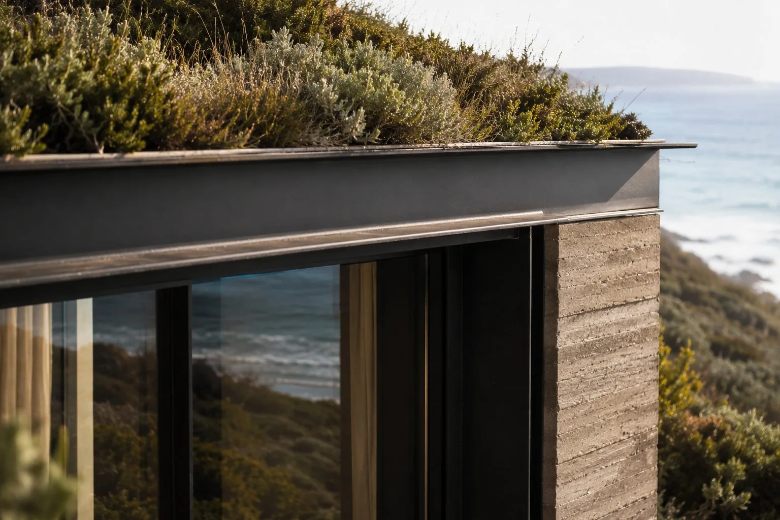 Detail focused frame of modern building with concrete walls and green heath on the roof