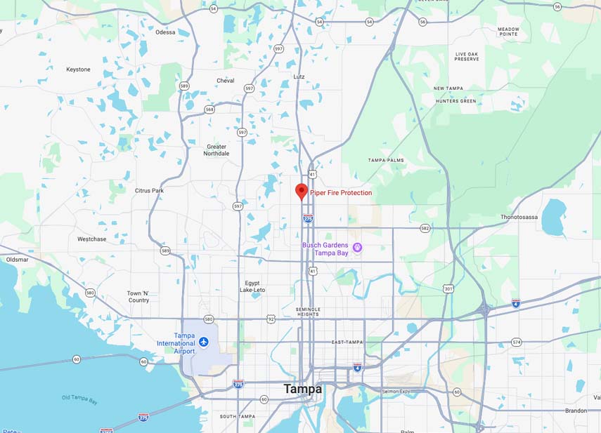 Map of Tampa, Florida area showing major roads and highways including I-275, US 41, 589, and 580, with a red marker indicating the location of Piper Fire Protection near I-275 north of downtown Tampa. Nearby landmarks include Busch Gardens Tampa Bay to the east, Tampa International Airport to the west, and neighborhoods such as Lutz, Greater Northdale, Citrus Park, and Seminole Heights. The map also shows waterways and green areas labeled as parks and preserves.