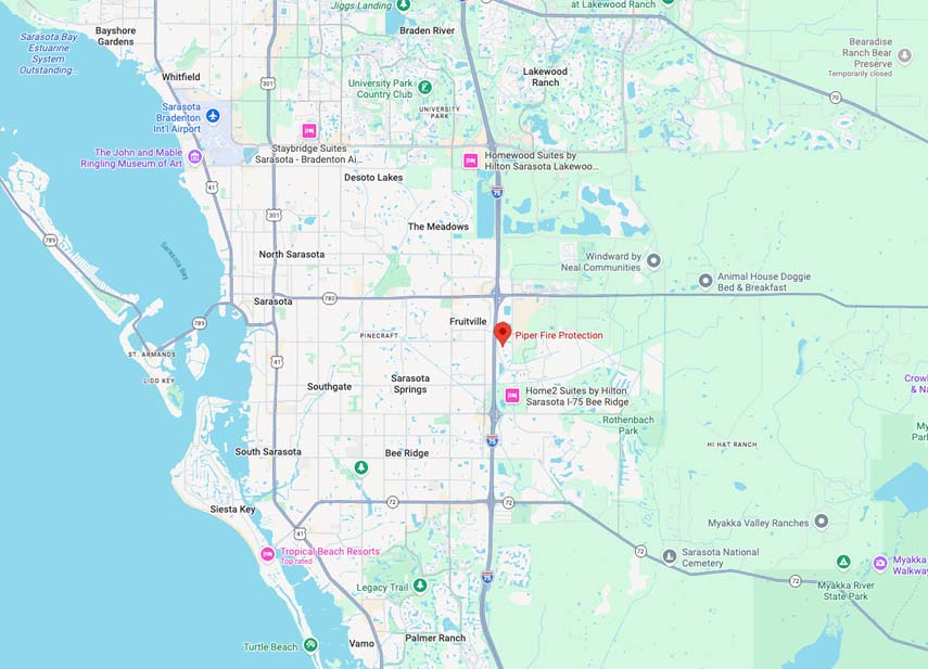 Map of Sarasota, Florida area showing neighborhoods like North Sarasota, South Sarasota, Sarasota Springs, Fruitville, and Bee Ridge, with locations marked such as Sarasota Bradenton International Airport, The John and Mable Ringling Museum of Art, Tropical Beach Resorts, various hotels including Staybridge Suites and Home2 Suites by Hilton, parks like Turtle Beach and Myakka River State Park, and landmarks including Sarasota National Cemetery and Bearadise Ranch Bear Preserve.