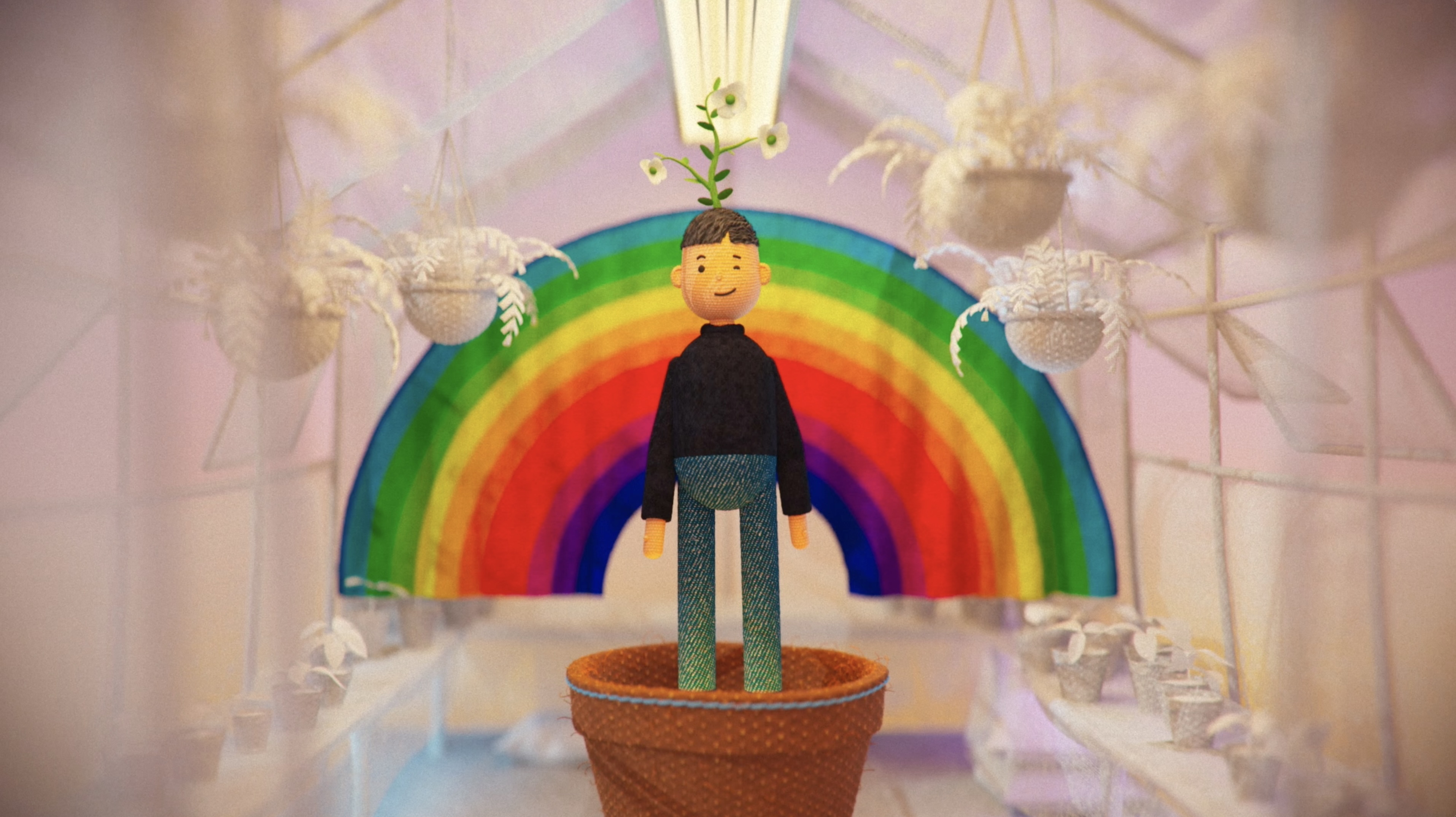 A young animated character stands beneath a rainbow in a handcrafted fantasy setting from Let Me Be Me.