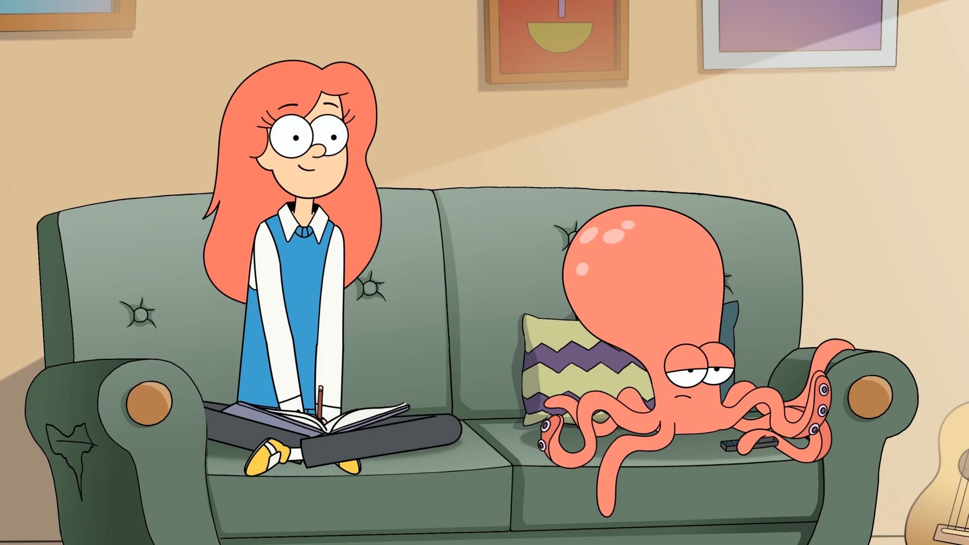 Cassandra and Solomon share a green couch in their Auckland flat.