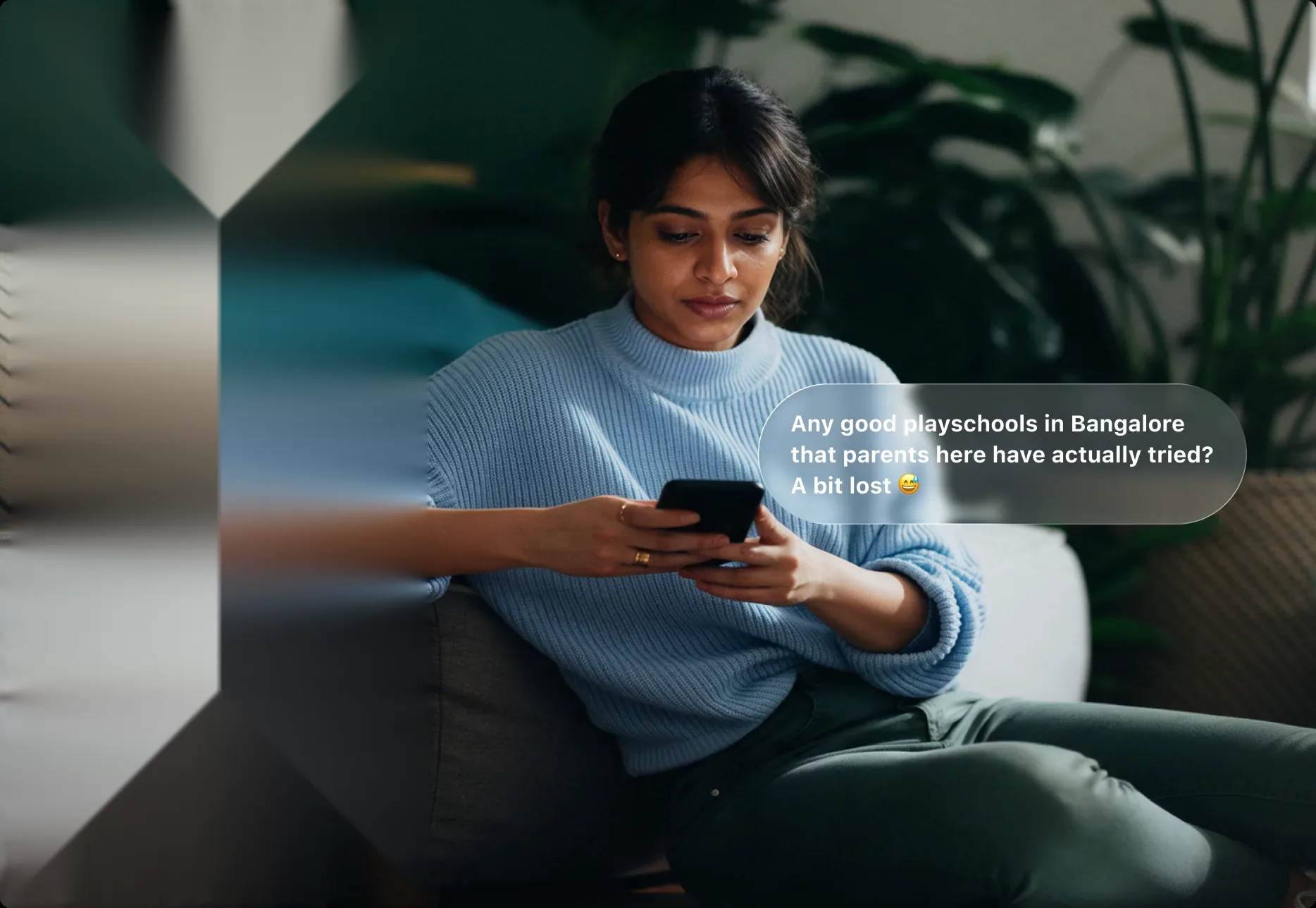 A mother on her phone asking other parents about playschools in Bangalore