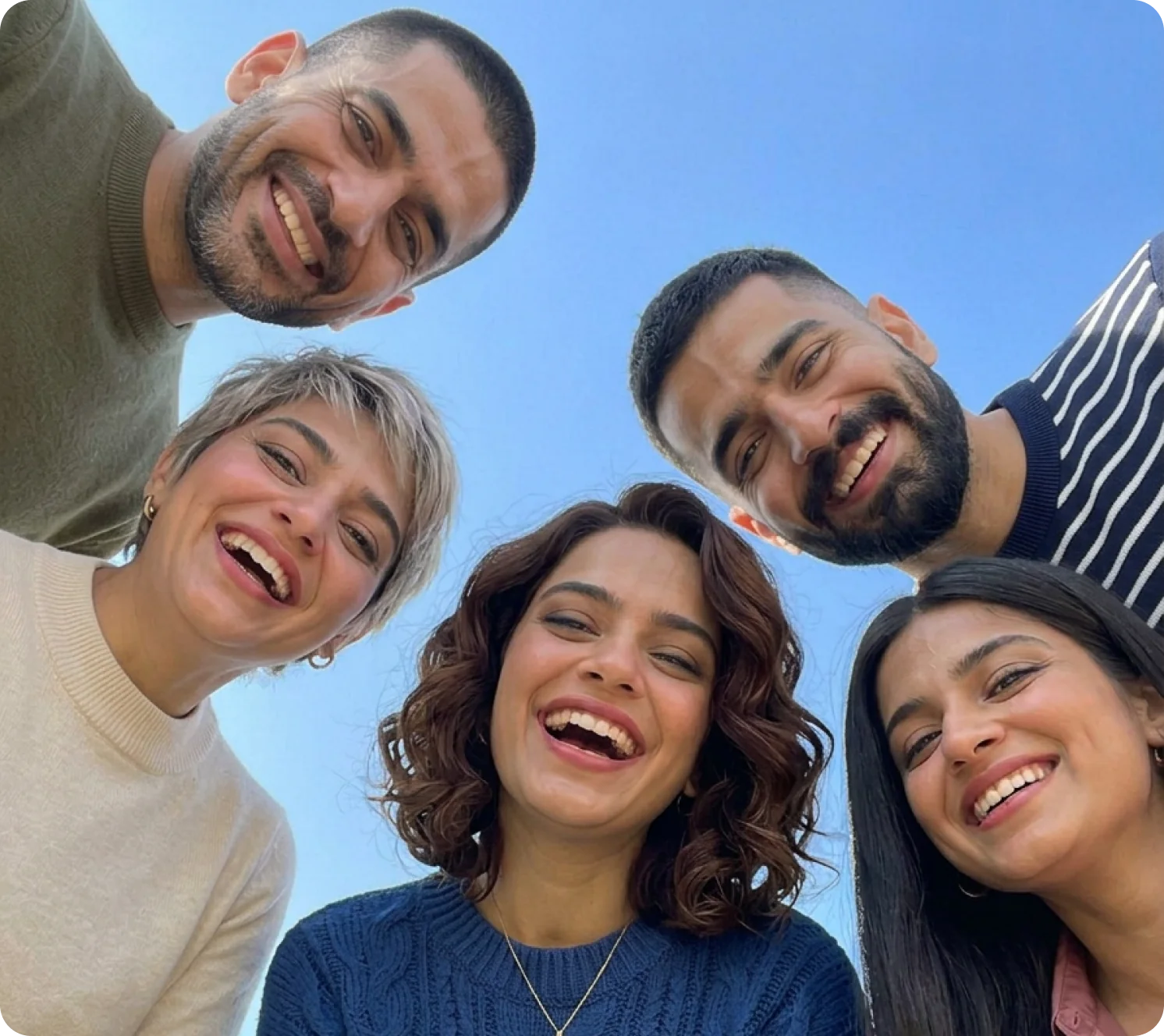 A group of smiling parents huddled together