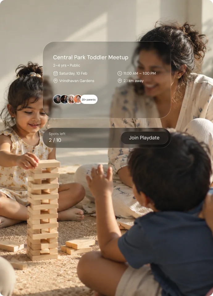 Parents and toddlers playing together with a toddler meetup event card