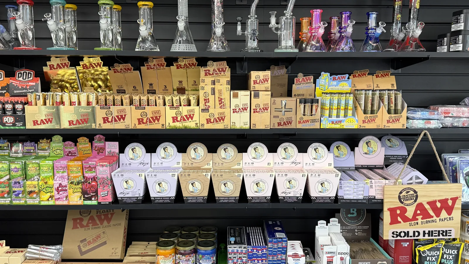 Rolling papers, cones, wraps, and cigarillos on display at Ember Smoke & Vape in Mesa, Arizona