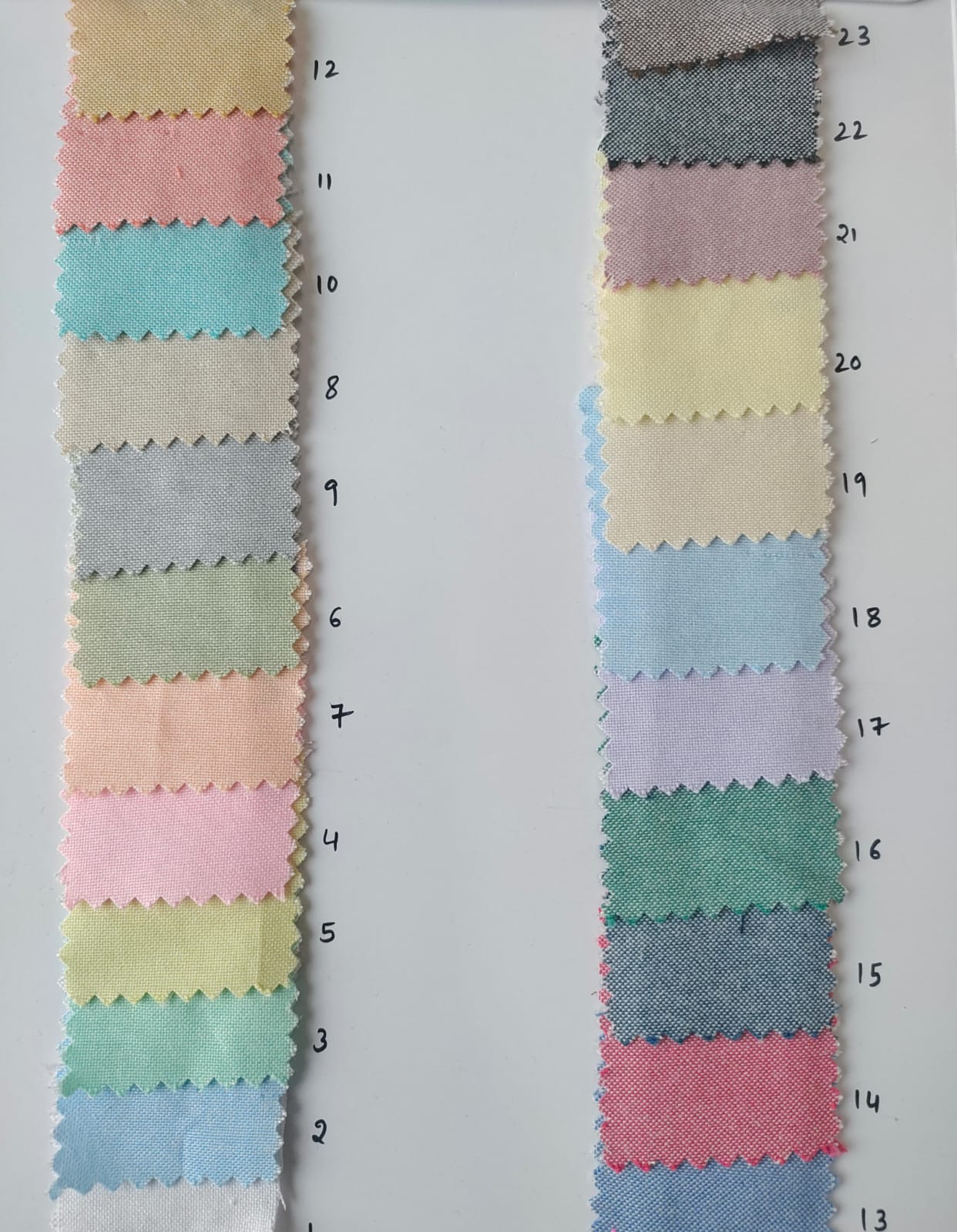 Close-up of soft, wrinkled pink cotton fabric displaying fine weave texture.