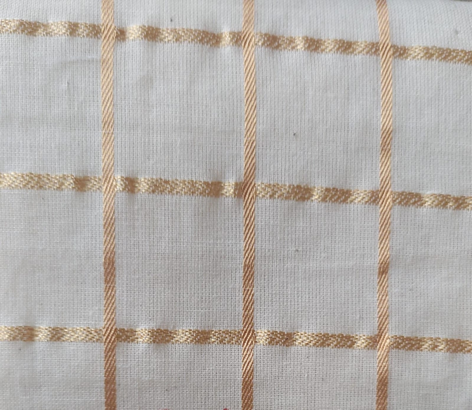 Close-up of soft, wrinkled pink cotton fabric displaying fine weave texture.