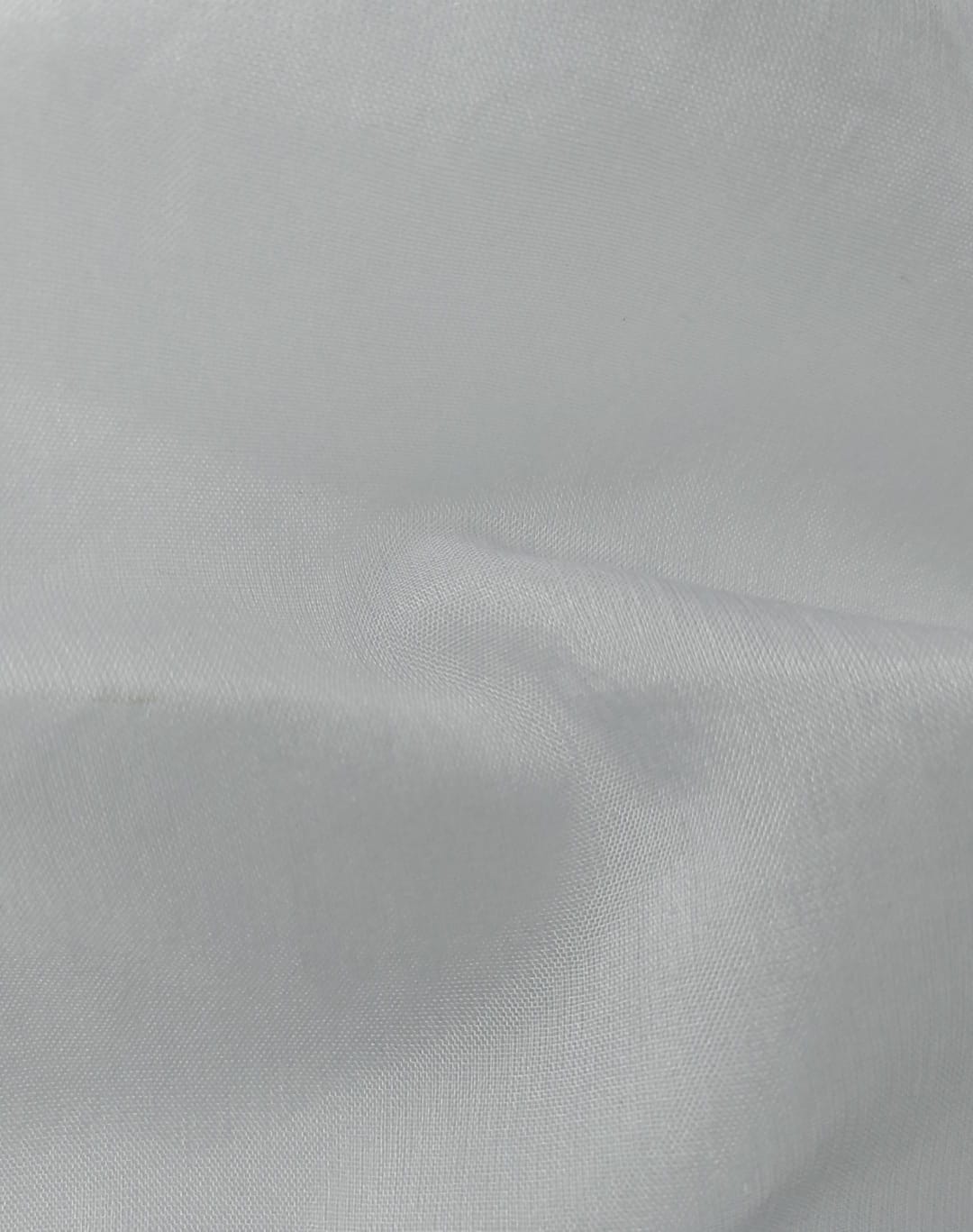 Close-up of soft, wrinkled pink cotton fabric displaying fine weave texture.