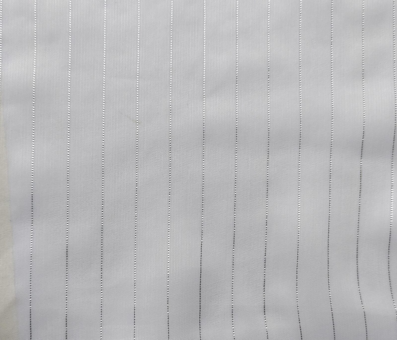 Close-up of soft, wrinkled pink cotton fabric displaying fine weave texture.
