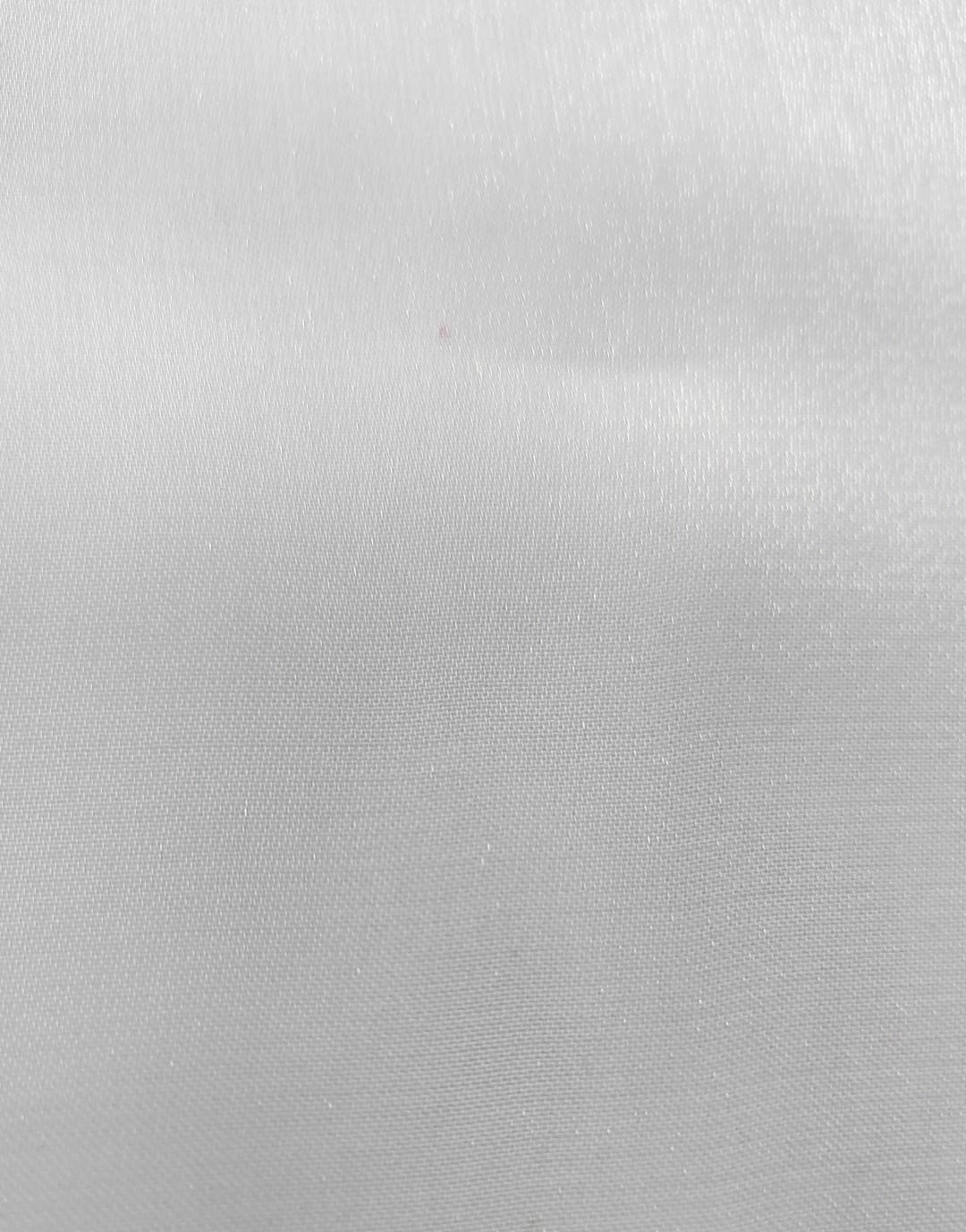 Close-up of soft, wrinkled pink cotton fabric displaying fine weave texture.