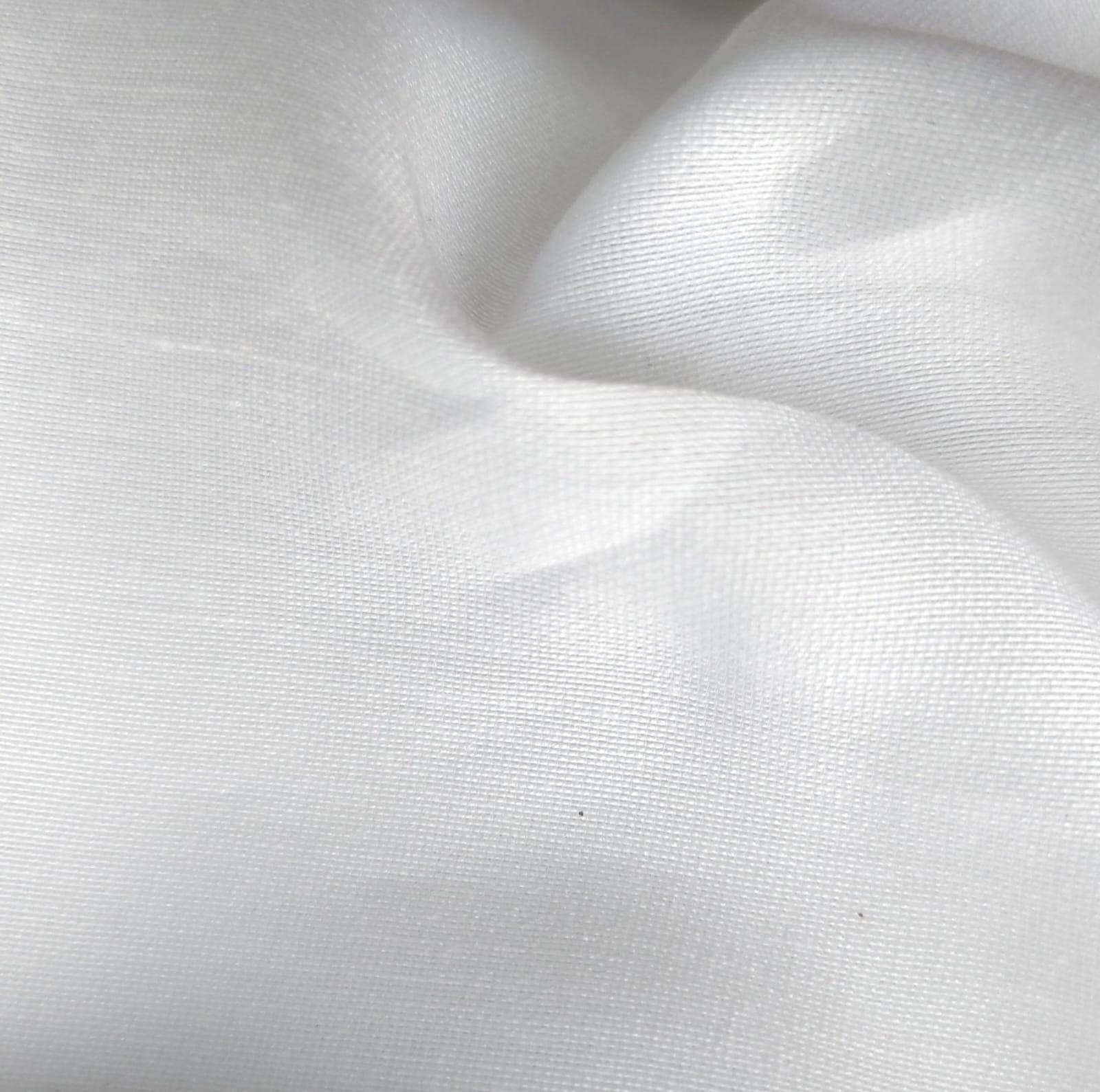 Close-up of soft, wrinkled pink cotton fabric displaying fine weave texture.