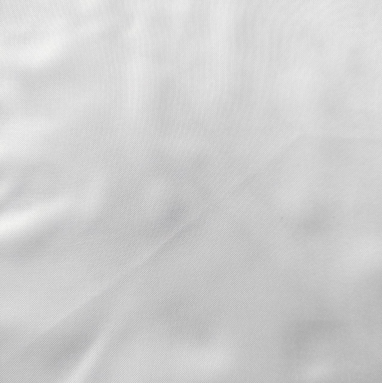 Close-up of soft, wrinkled pink cotton fabric displaying fine weave texture.