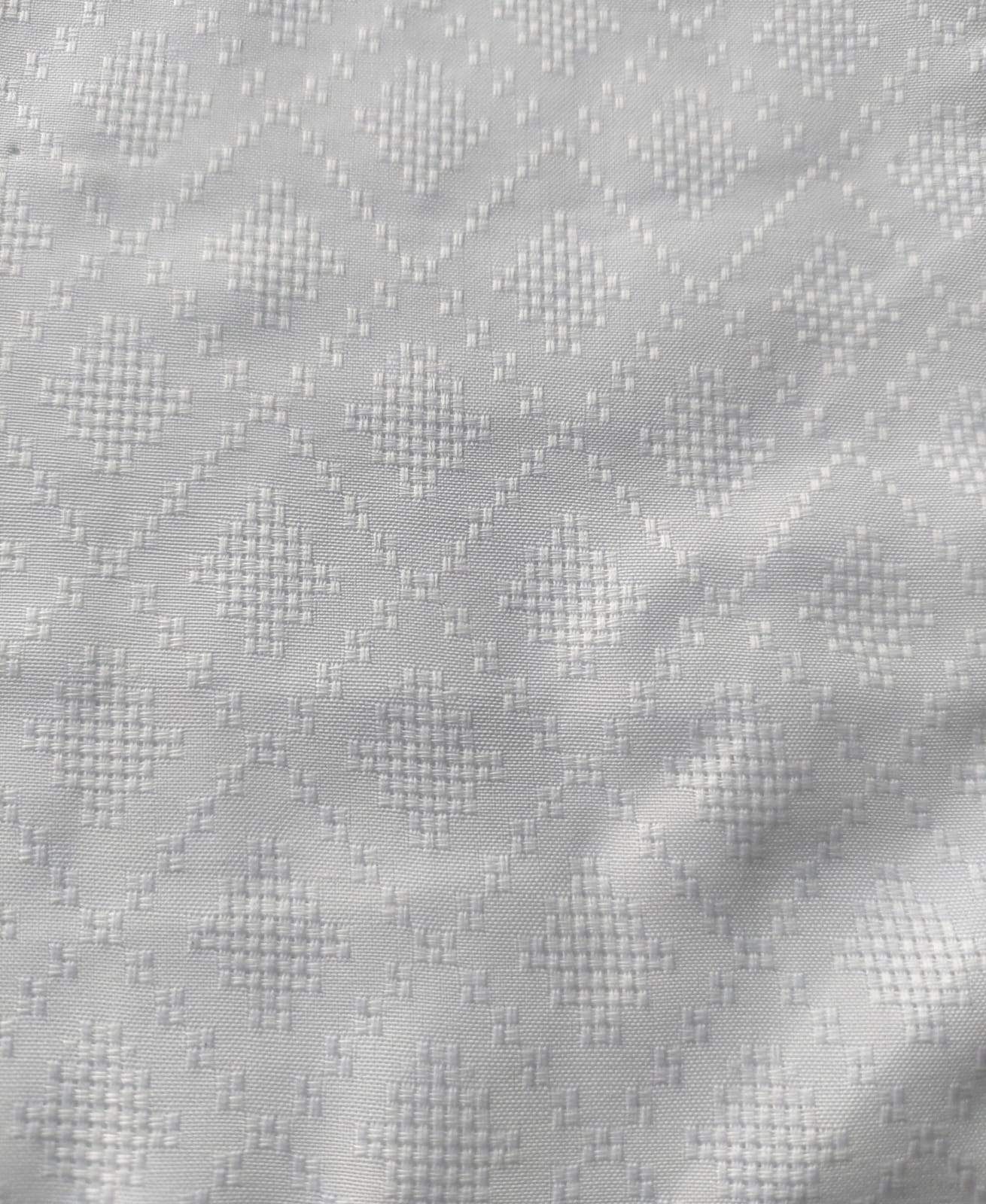 Close-up of soft, wrinkled pink cotton fabric displaying fine weave texture.