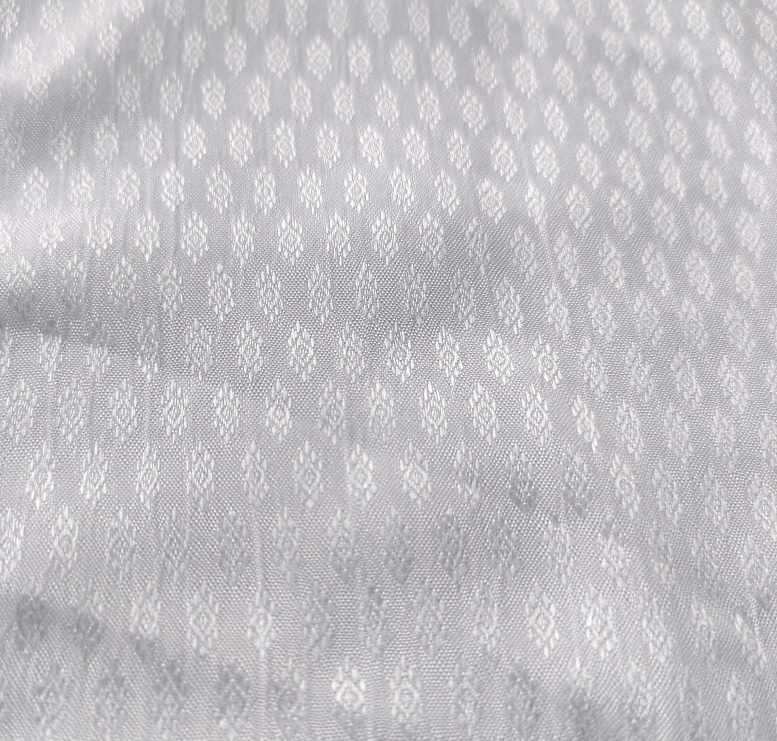 Close-up of soft, wrinkled pink cotton fabric displaying fine weave texture.