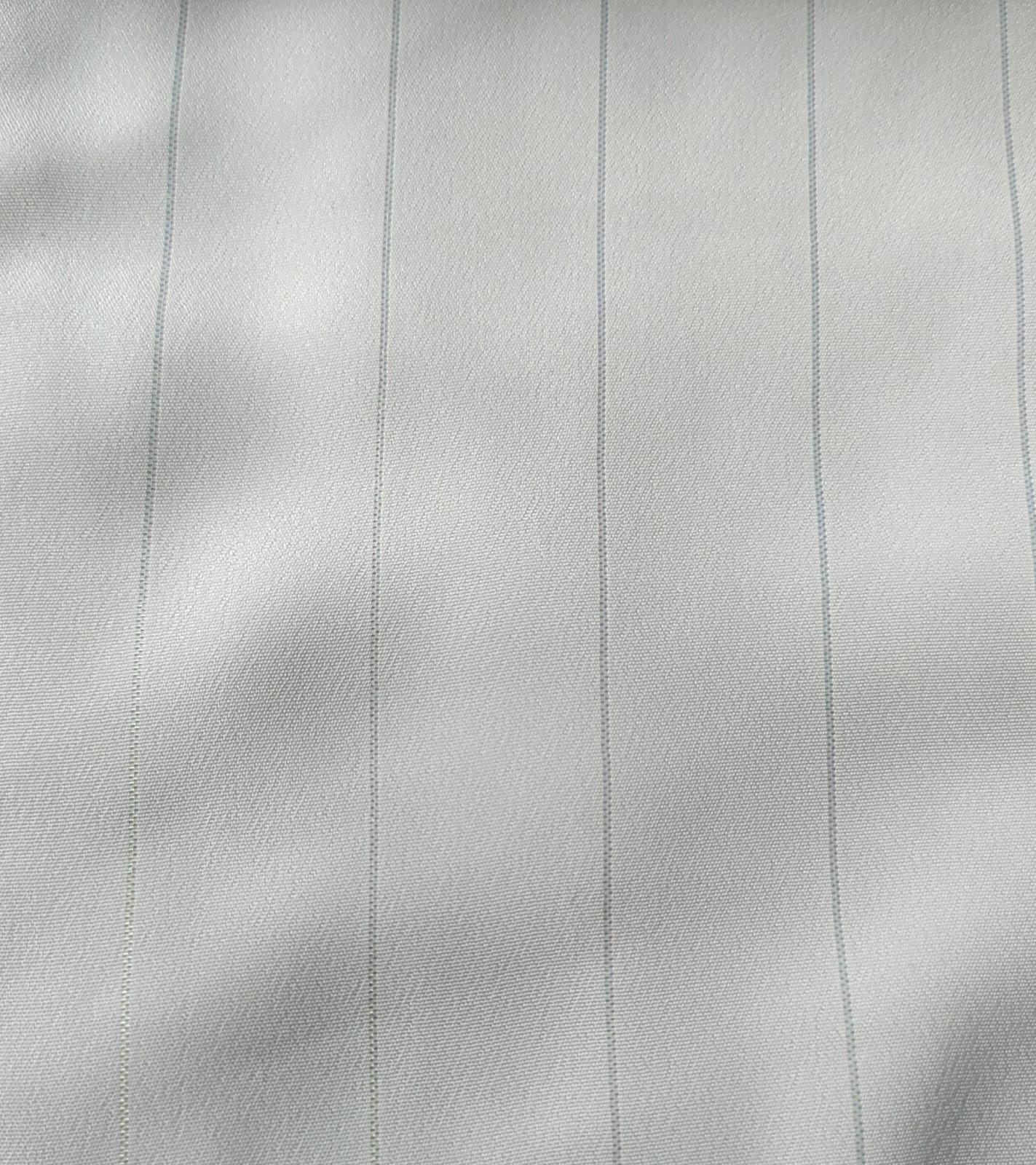 Close-up of soft, wrinkled pink cotton fabric displaying fine weave texture.