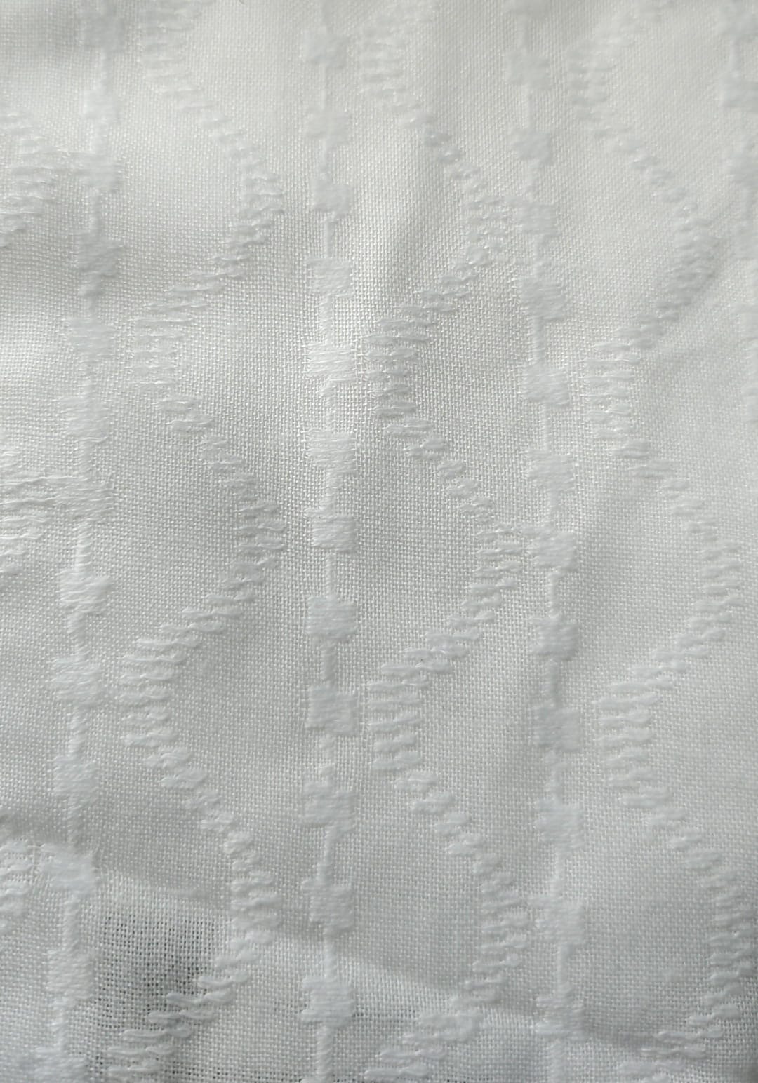 Close-up of soft, wrinkled pink cotton fabric displaying fine weave texture.