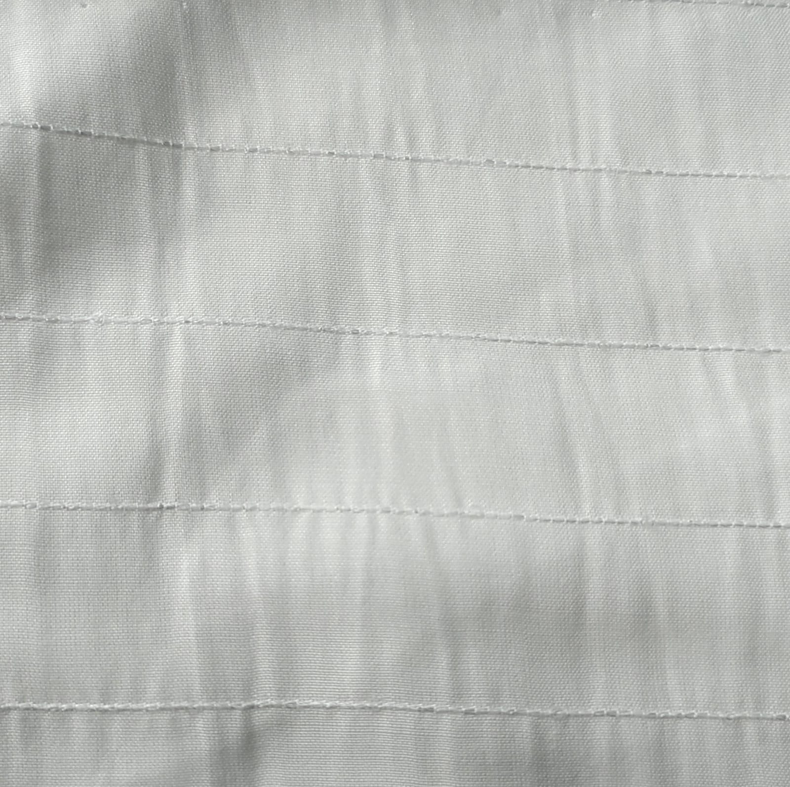 Close-up of soft, wrinkled pink cotton fabric displaying fine weave texture.