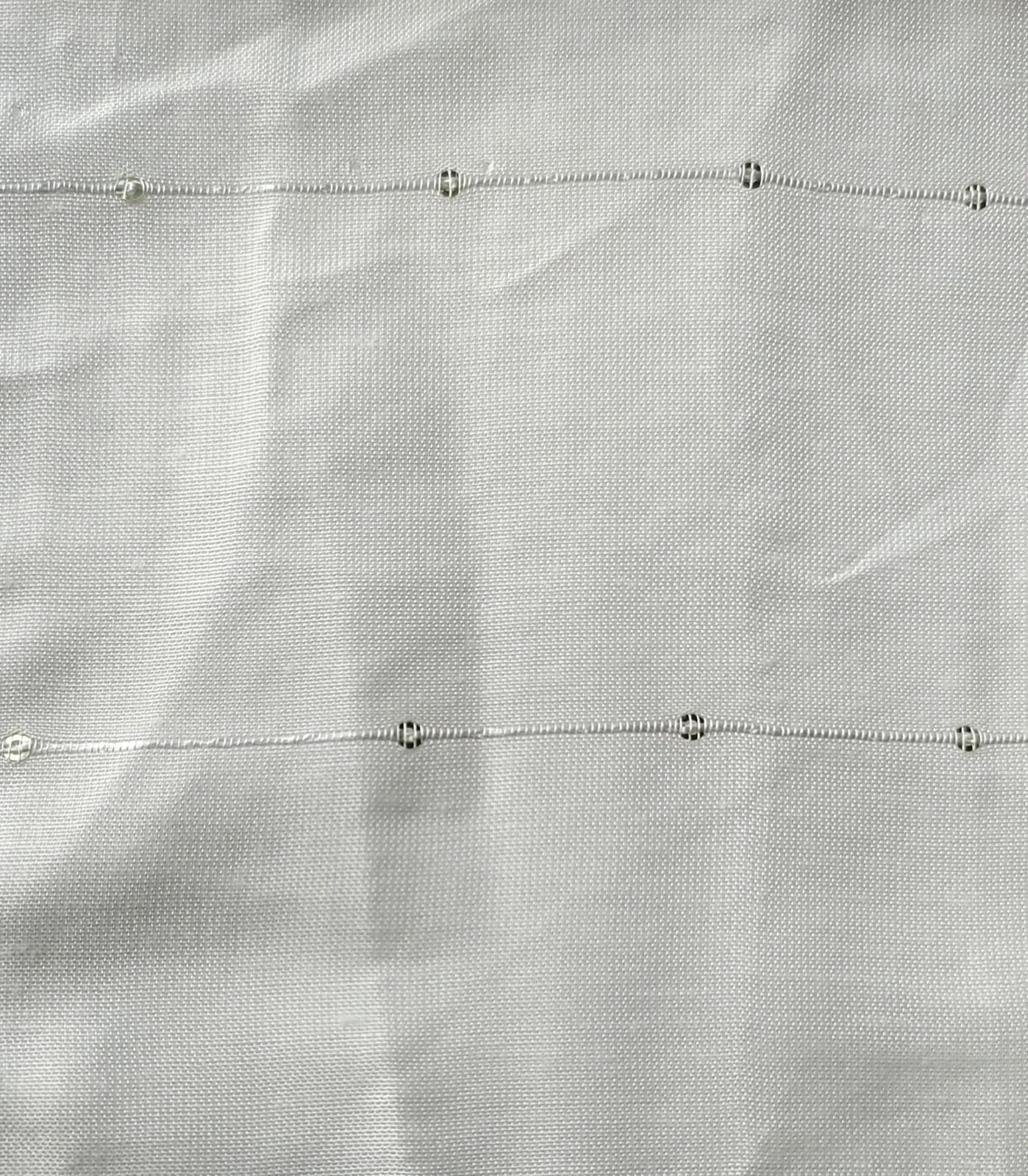 Close-up of soft, wrinkled pink cotton fabric displaying fine weave texture.