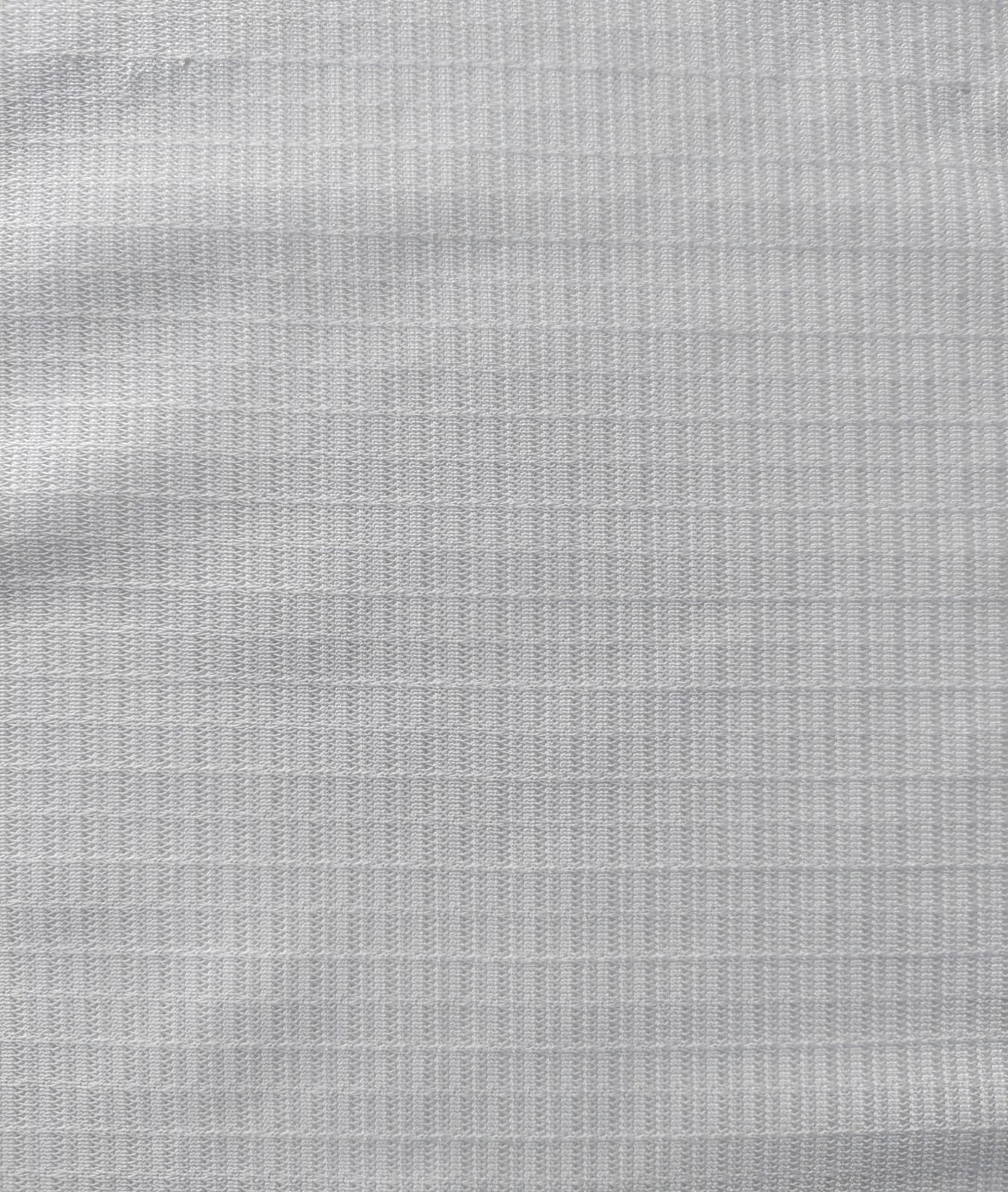 Close-up of soft, wrinkled pink cotton fabric displaying fine weave texture.