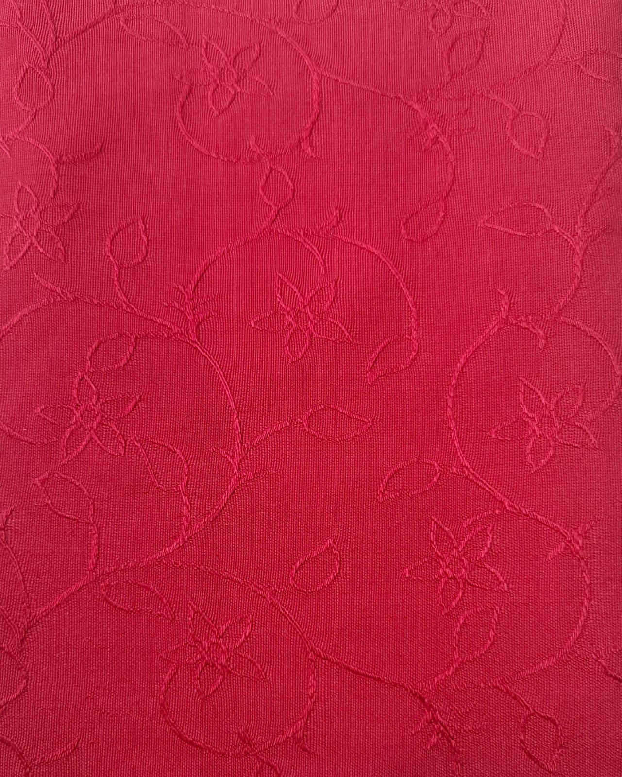 Close-up of soft, wrinkled pink cotton fabric displaying fine weave texture.