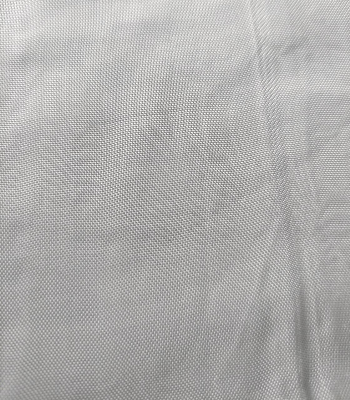 Close-up of soft, wrinkled pink cotton fabric displaying fine weave texture.