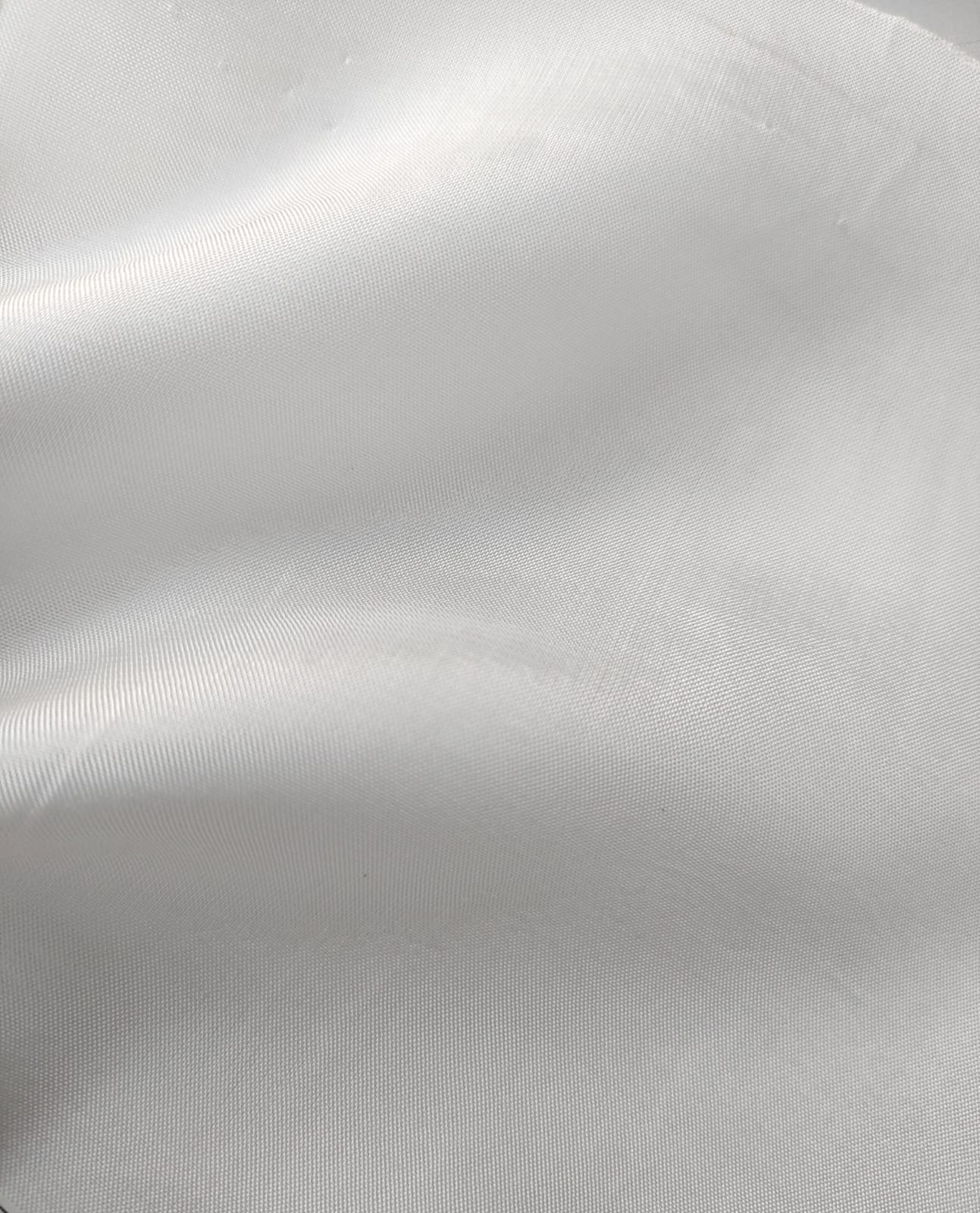 Close-up of soft, wrinkled pink cotton fabric displaying fine weave texture.