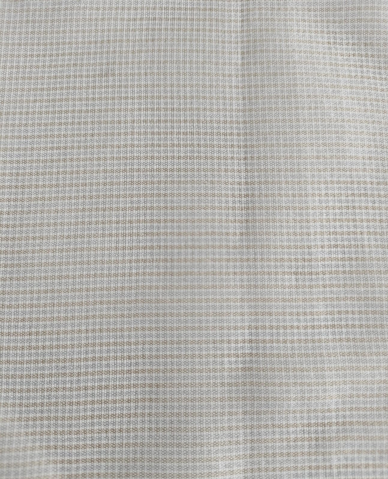 Close-up of soft, wrinkled pink cotton fabric displaying fine weave texture.