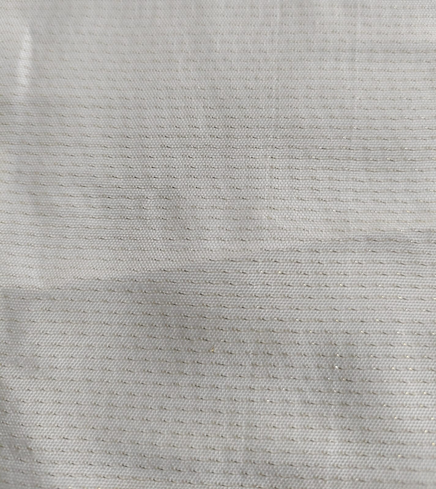 Close-up of soft, wrinkled pink cotton fabric displaying fine weave texture.