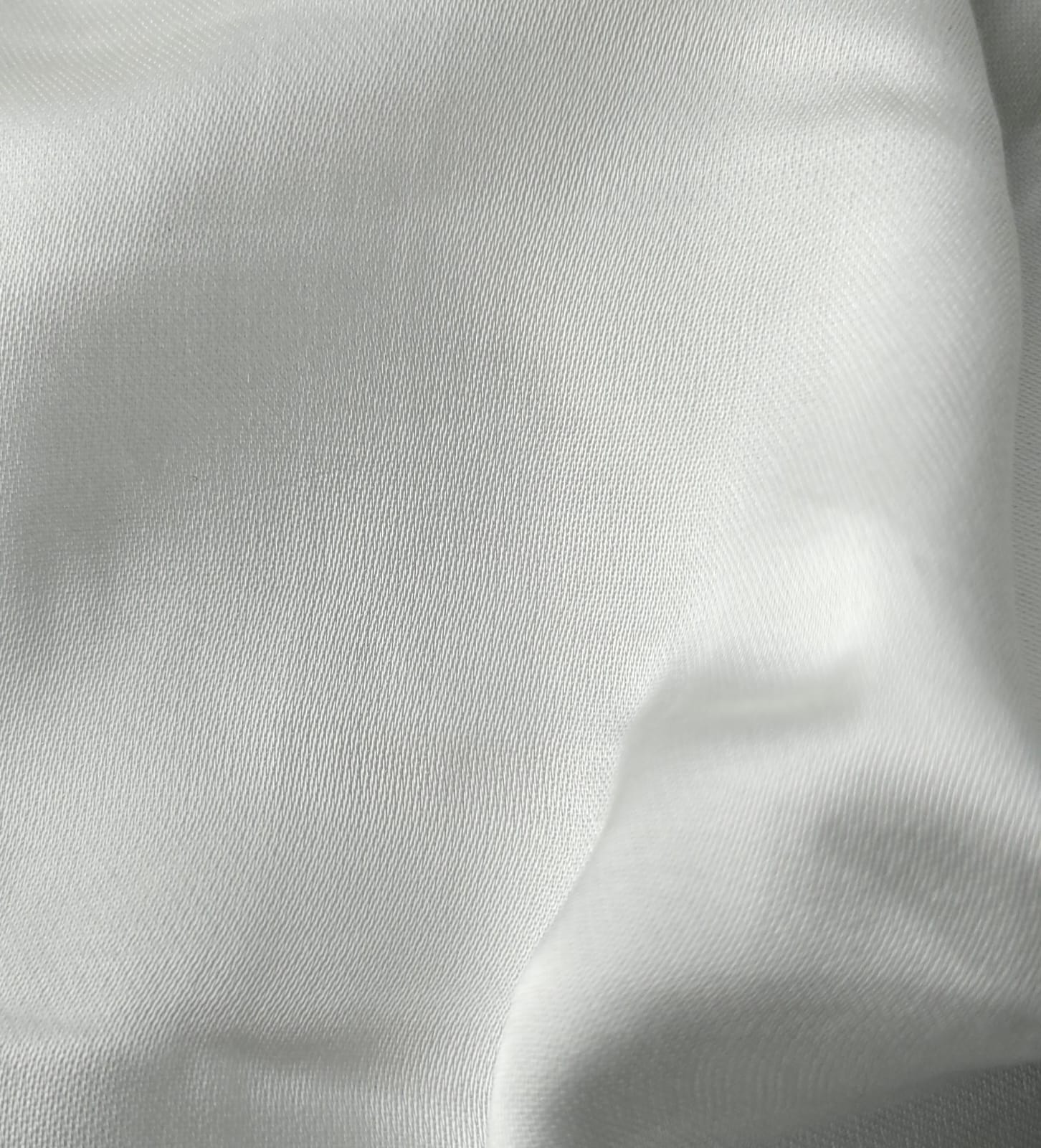 Close-up of soft, wrinkled pink cotton fabric displaying fine weave texture.