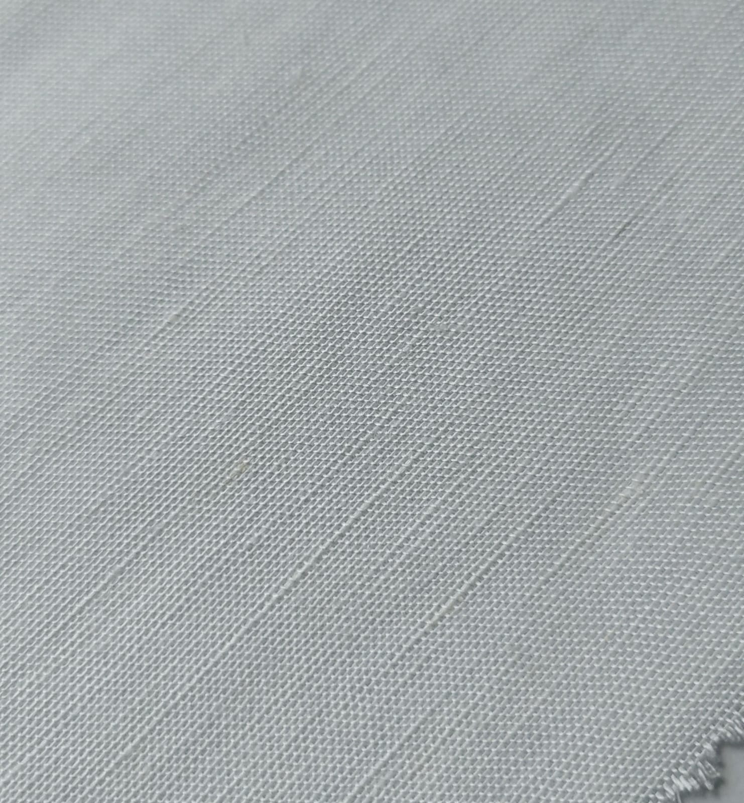 Close-up of soft, wrinkled pink cotton fabric displaying fine weave texture.