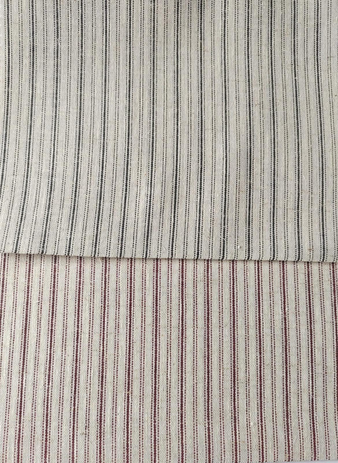 Close-up of soft, wrinkled pink cotton fabric displaying fine weave texture.
