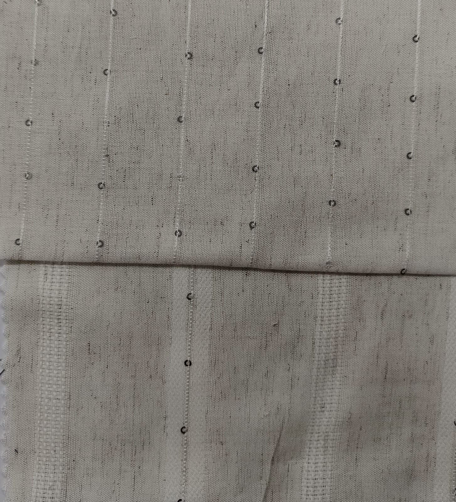 Close-up of soft, wrinkled pink cotton fabric displaying fine weave texture.