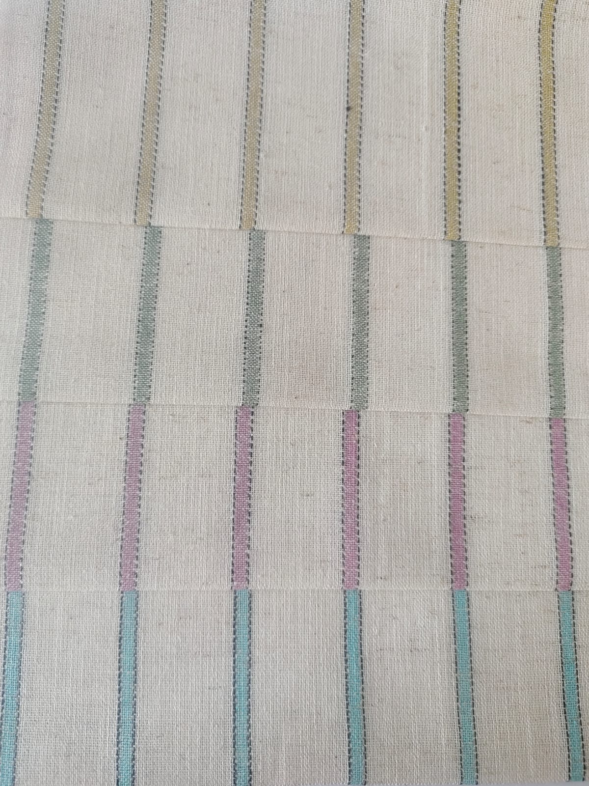 Close-up of soft, wrinkled pink cotton fabric displaying fine weave texture.