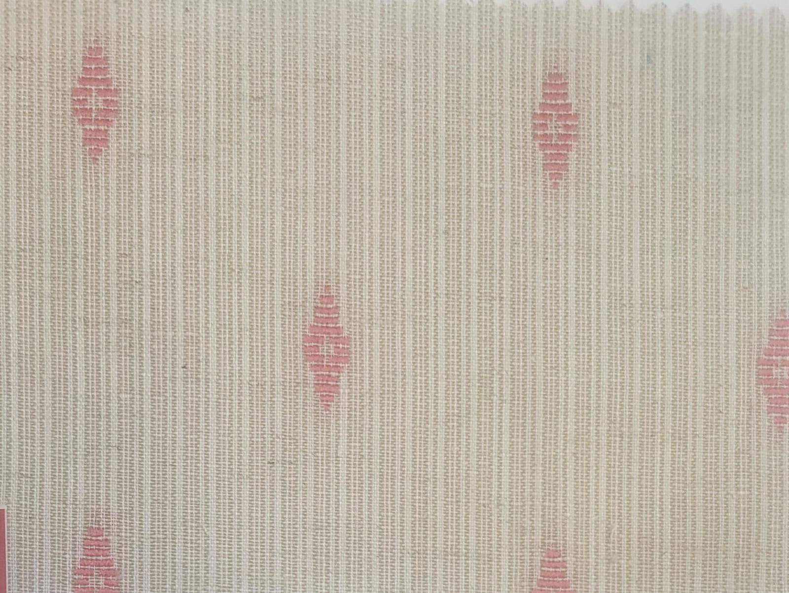 Close-up of soft, wrinkled pink cotton fabric displaying fine weave texture.