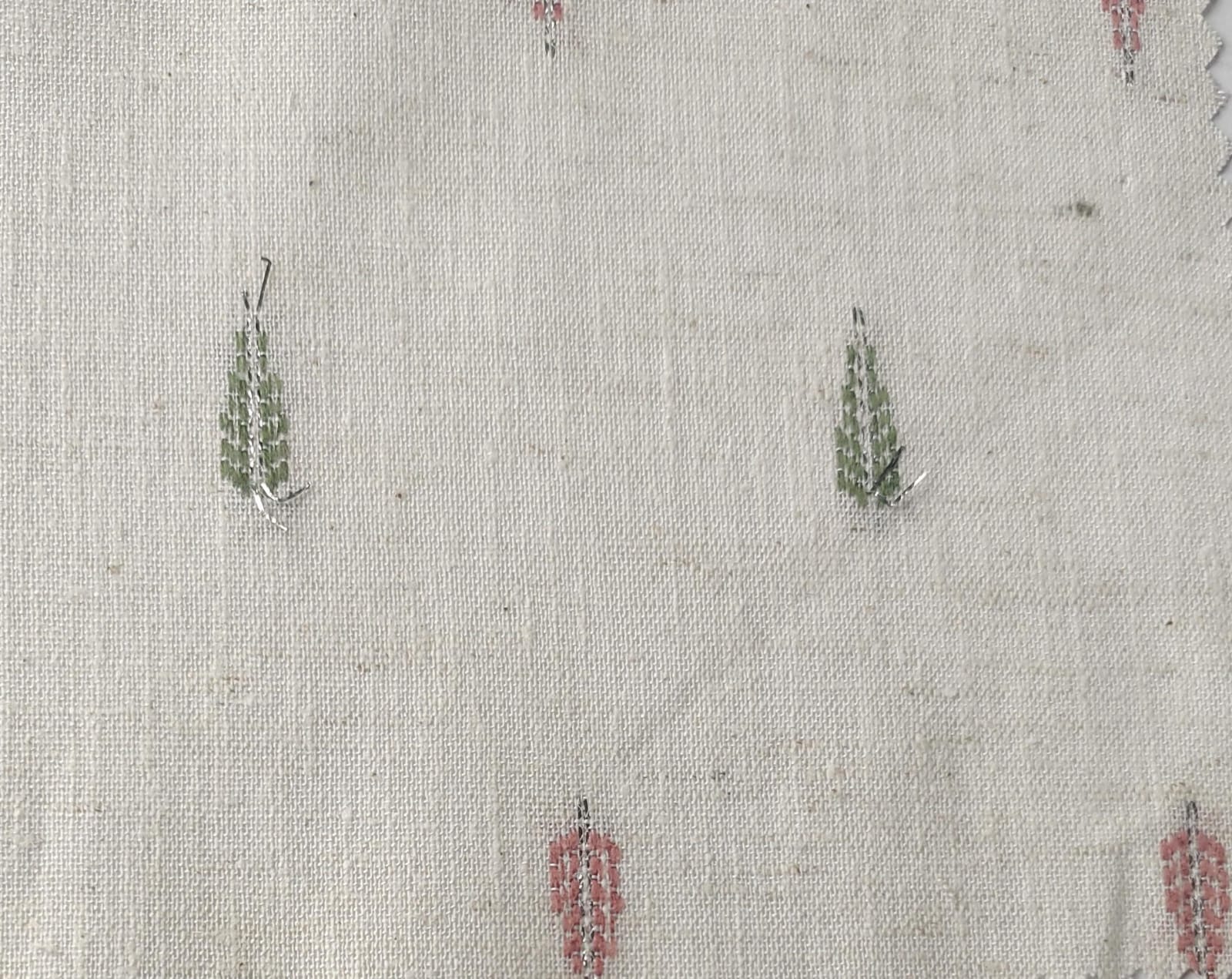Close-up of soft, wrinkled pink cotton fabric displaying fine weave texture.