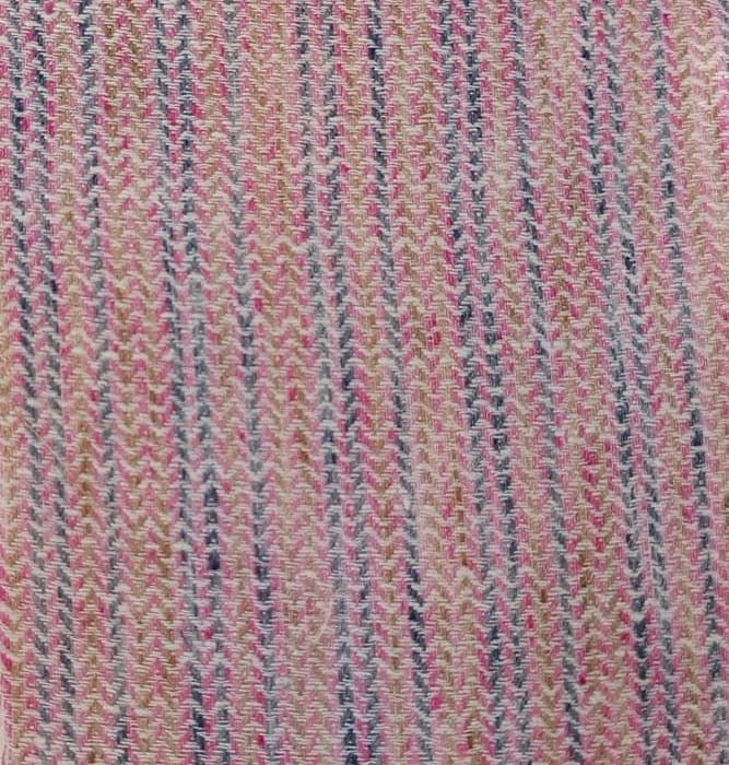 Close-up of soft, wrinkled pink cotton fabric displaying fine weave texture.