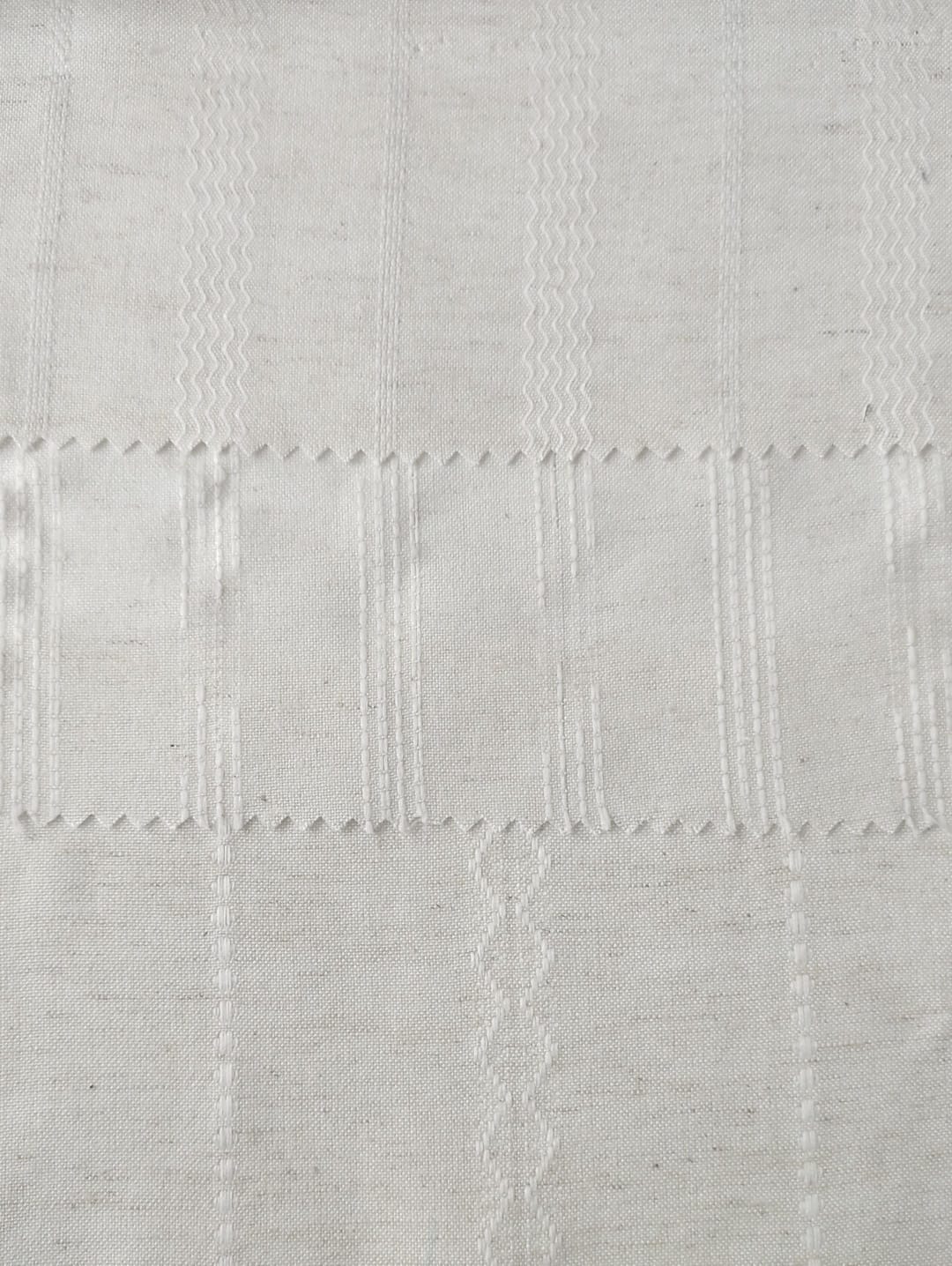 Close-up of soft, wrinkled pink cotton fabric displaying fine weave texture.
