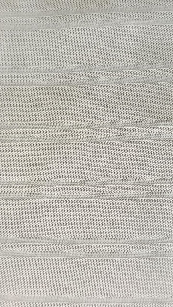 Close-up of soft, wrinkled pink cotton fabric displaying fine weave texture.