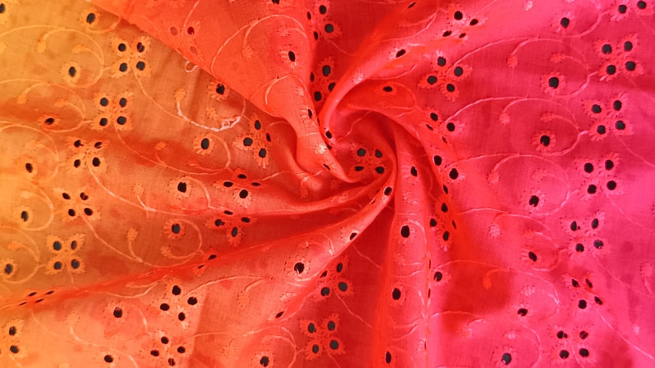 Close-up of soft, wrinkled pink cotton fabric displaying fine weave texture.